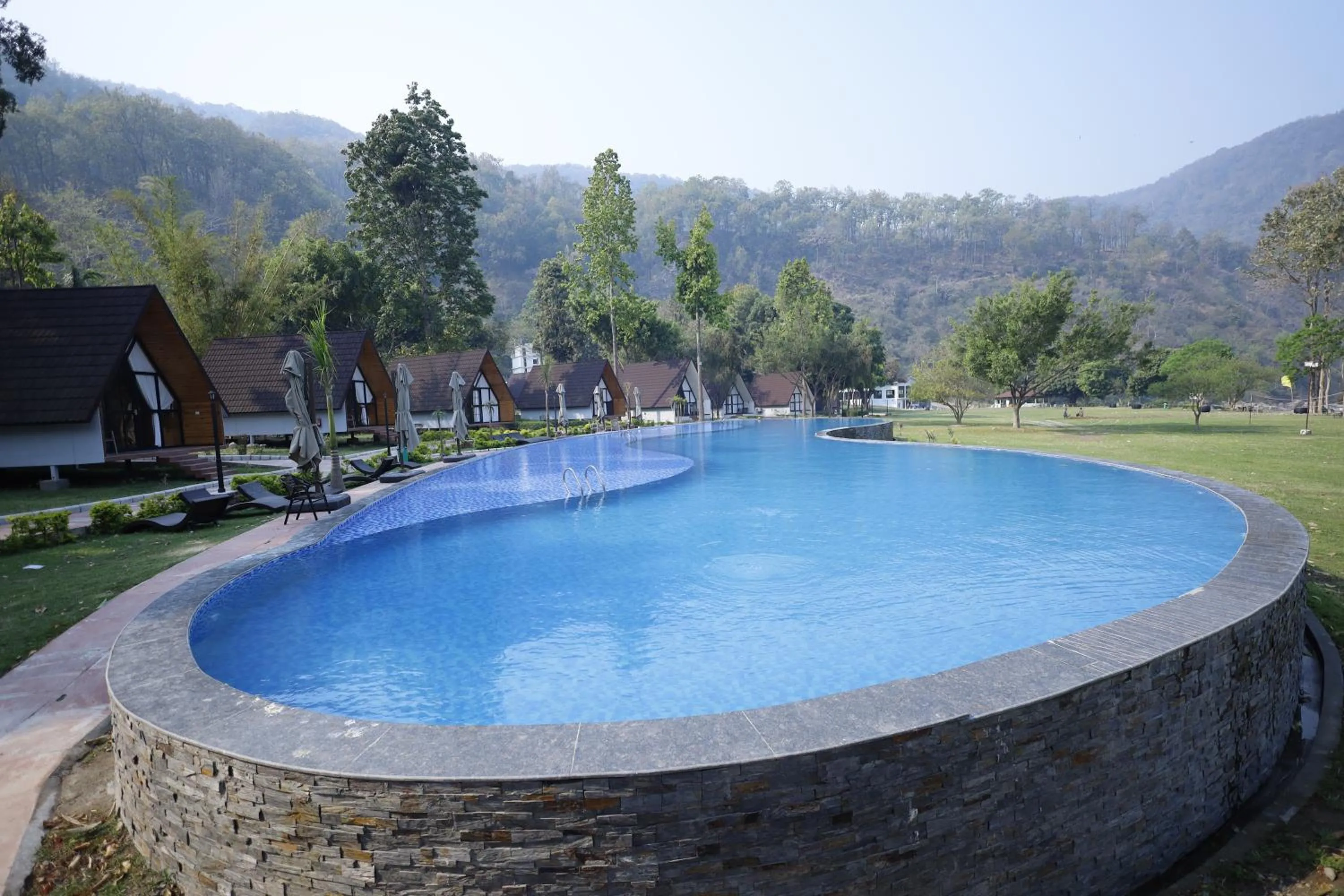 Swimming pool in WelcomHeritage Tarangi Ramganga Resort