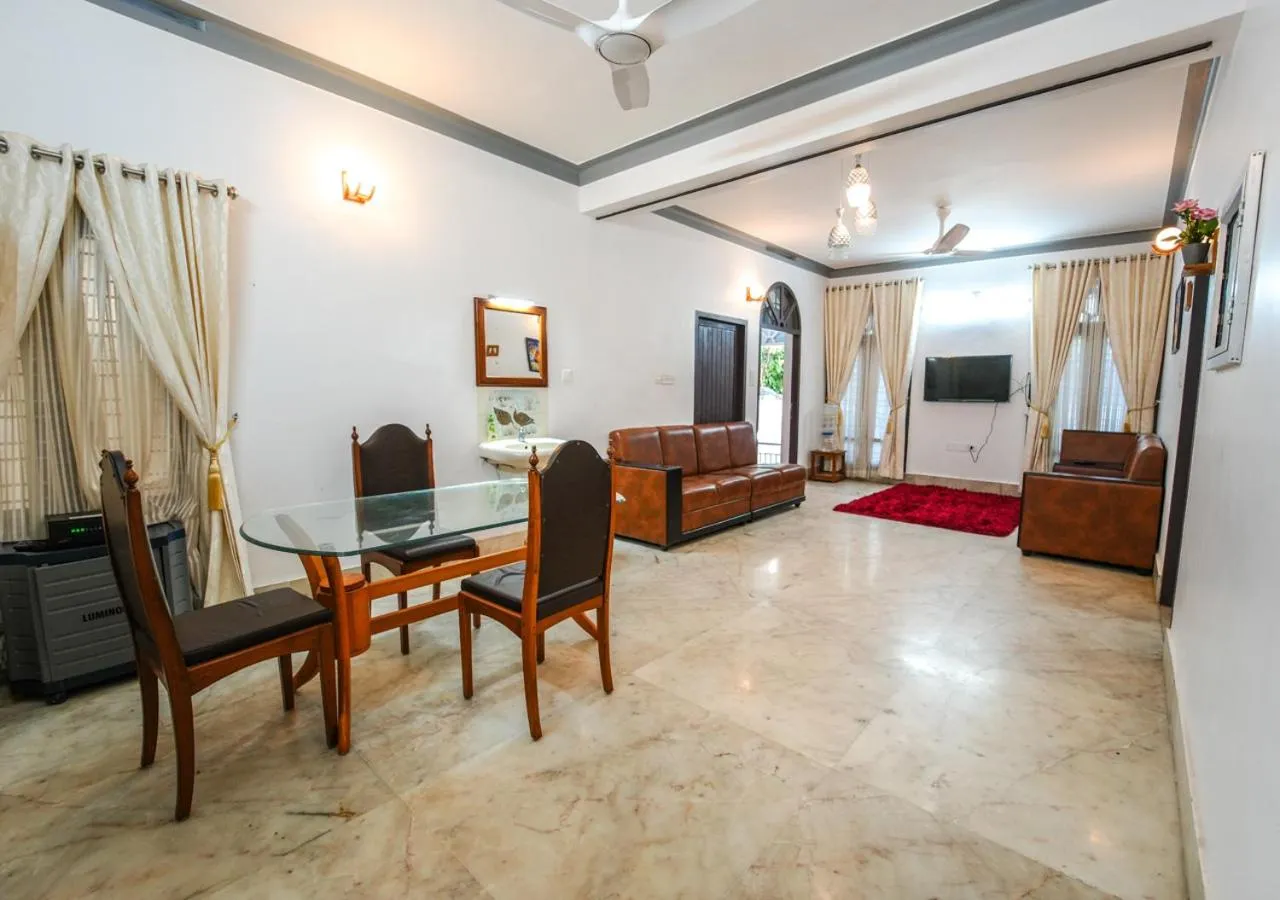 Living room in Pop Tavern Private Pool Villa Kovalam by VOYE HOMES