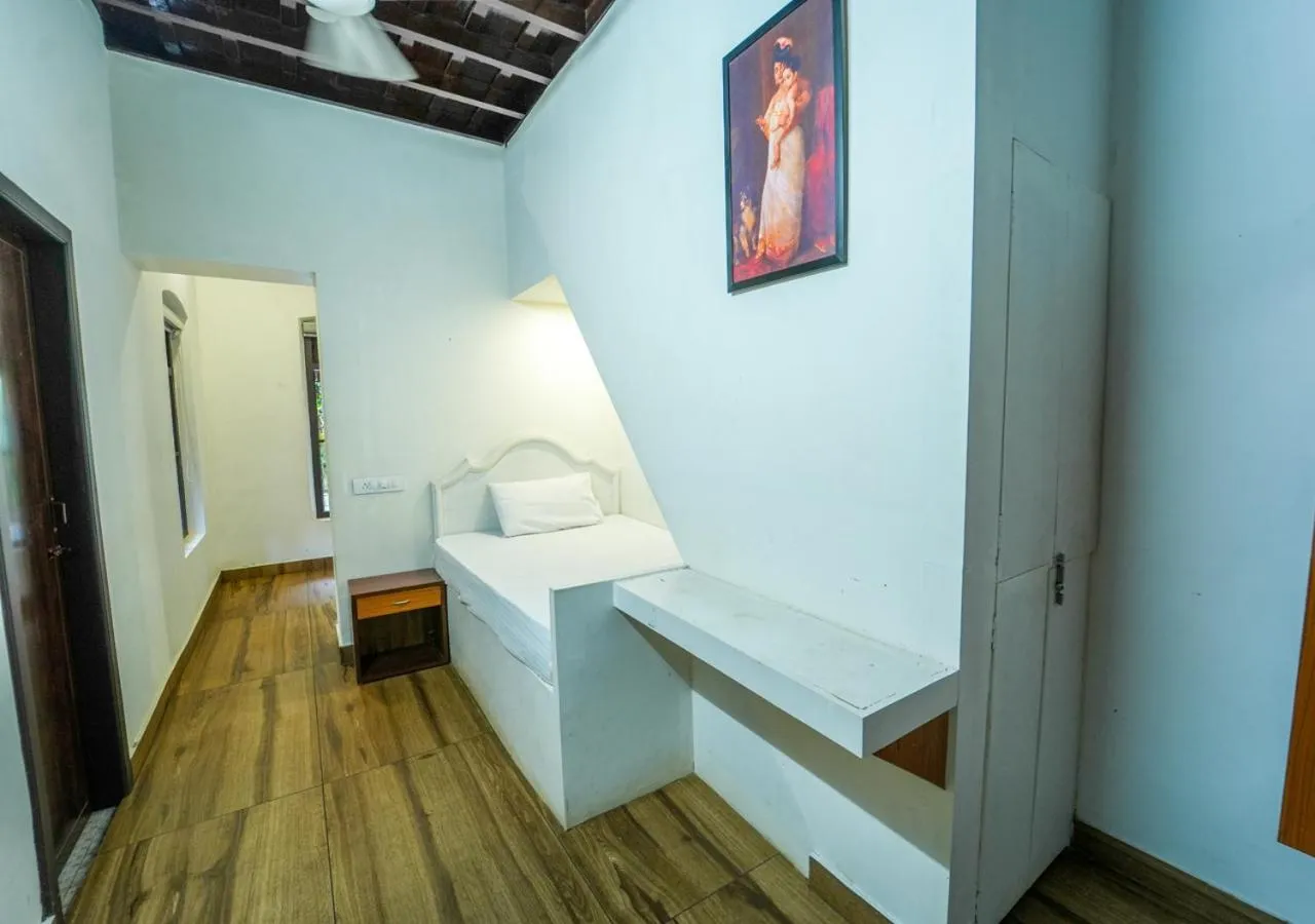 Bed in Pop Tavern Private Pool Villa Kovalam by VOYE HOMES