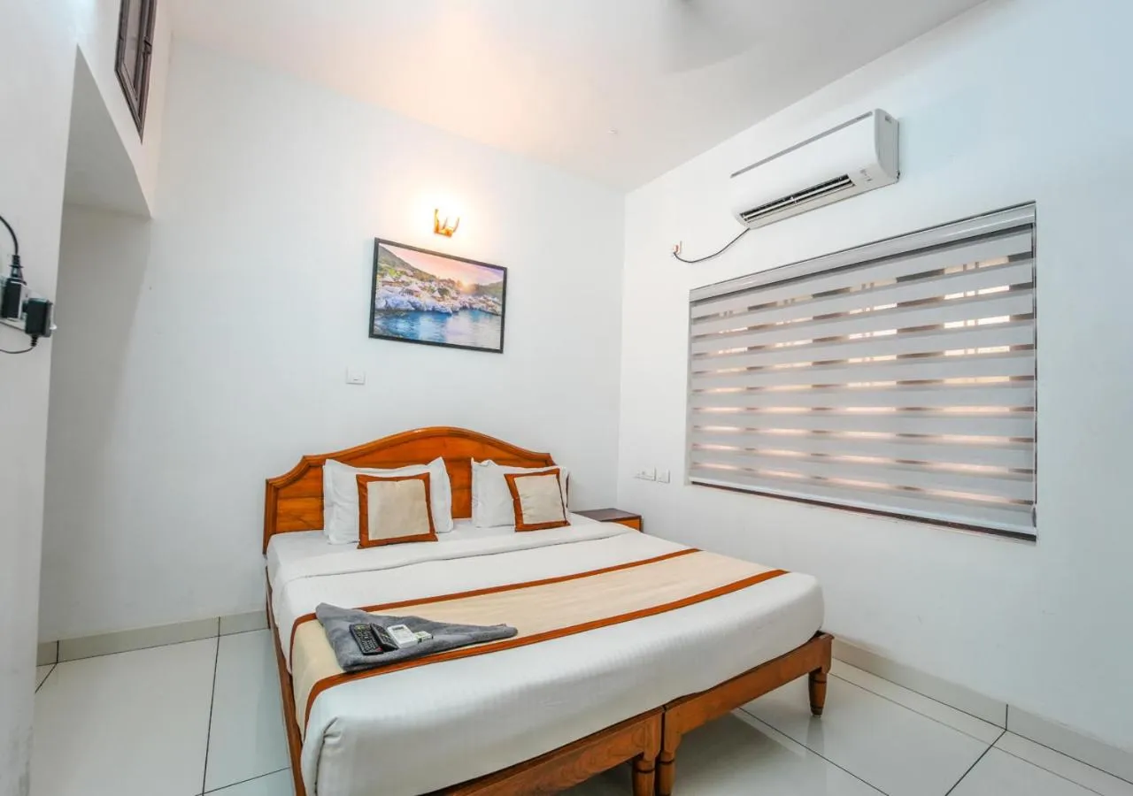 Bed in Pop Tavern Private Pool Villa Kovalam by VOYE HOMES