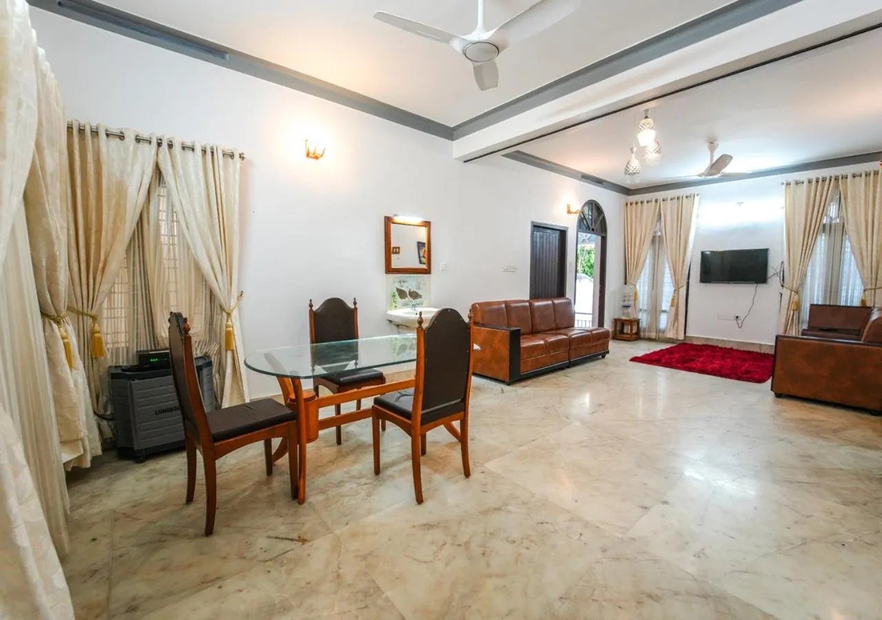 TV and multimedia in Pop Tavern Private Pool Villa Kovalam by VOYE HOMES