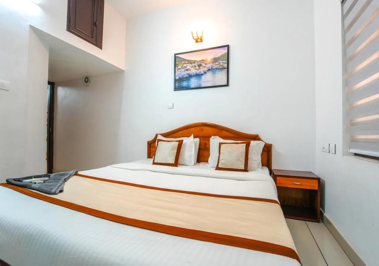 Bed in Pop Tavern Private Pool Villa Kovalam by VOYE HOMES