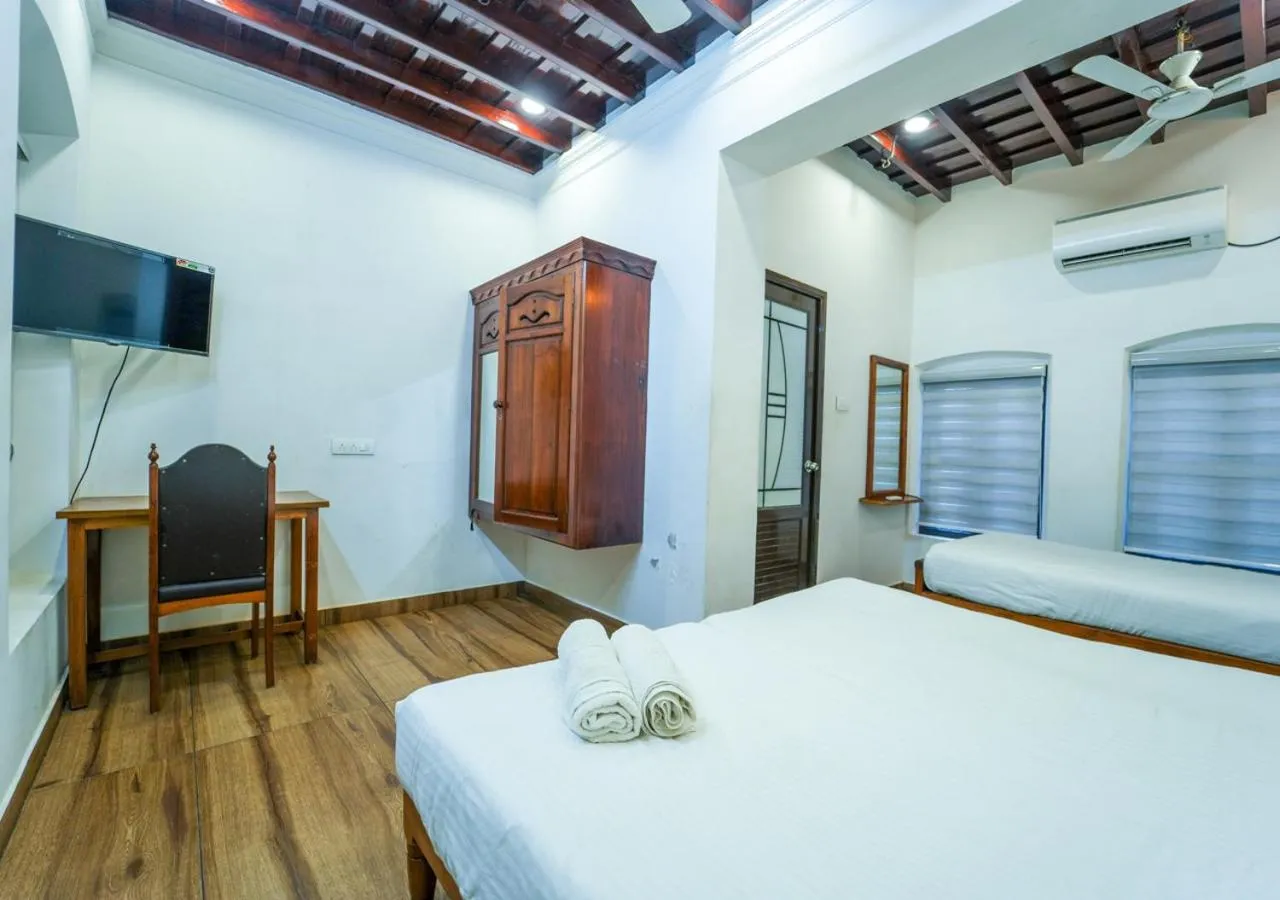 TV and multimedia, Bed in Pop Tavern Private Pool Villa Kovalam by VOYE HOMES