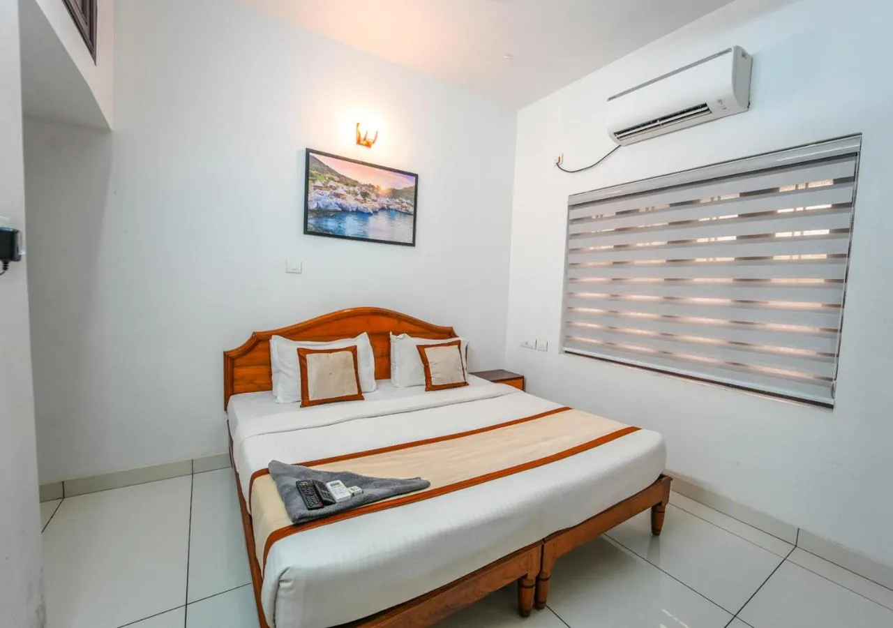 Bed in Pop Tavern Private Pool Villa Kovalam by VOYE HOMES