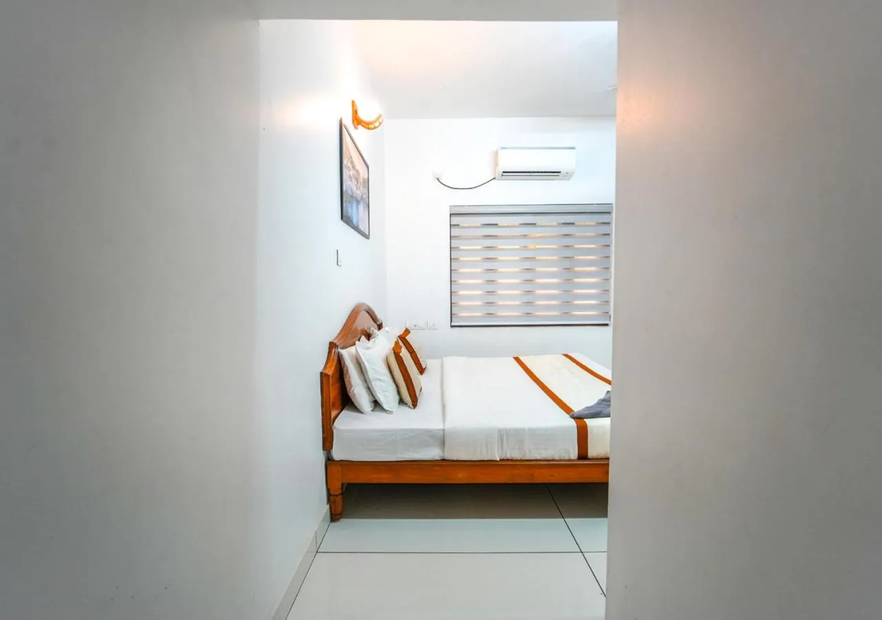 Bed in Pop Tavern Private Pool Villa Kovalam by VOYE HOMES