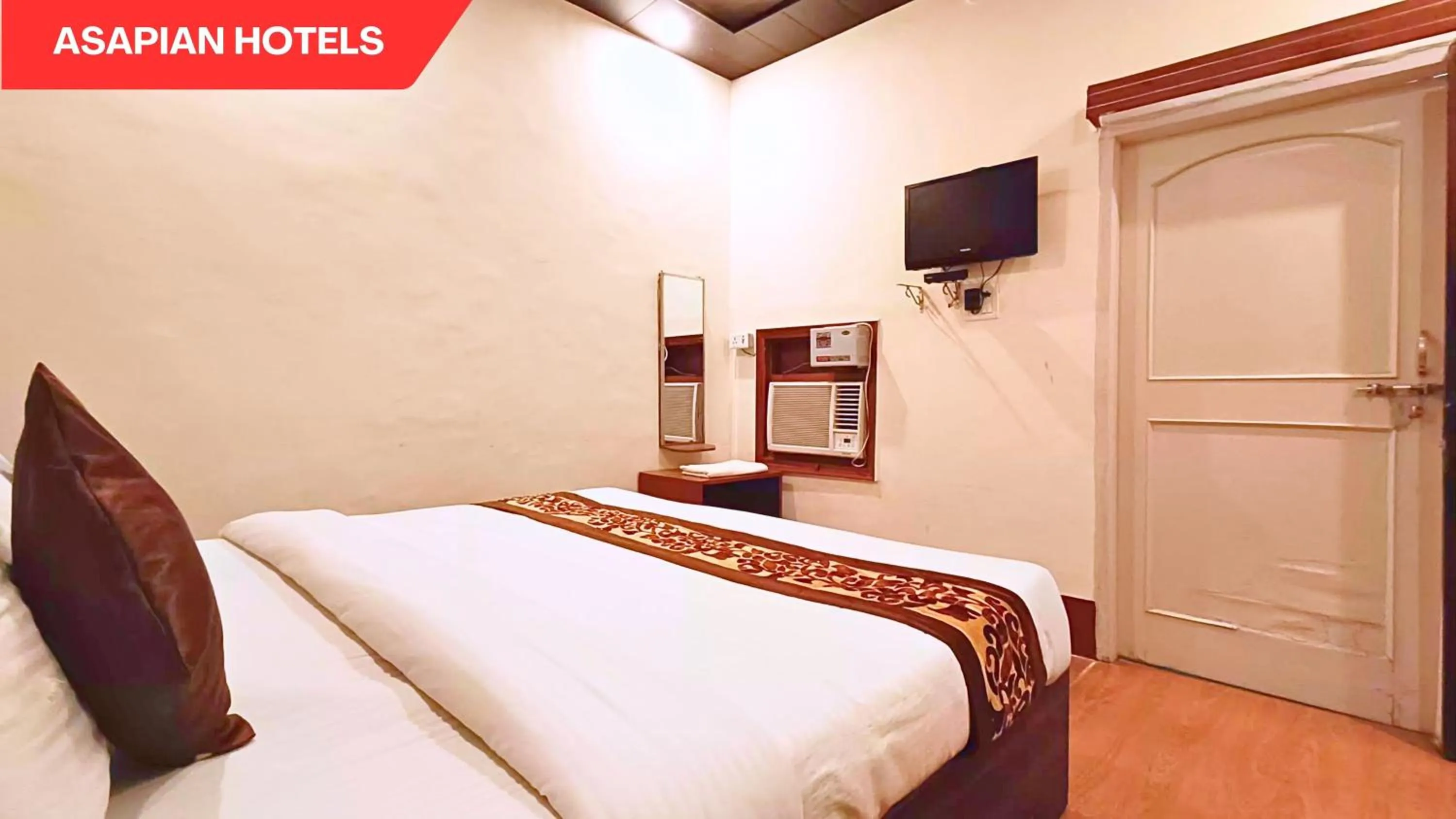 Bed in Hotel Vijay Deluxe