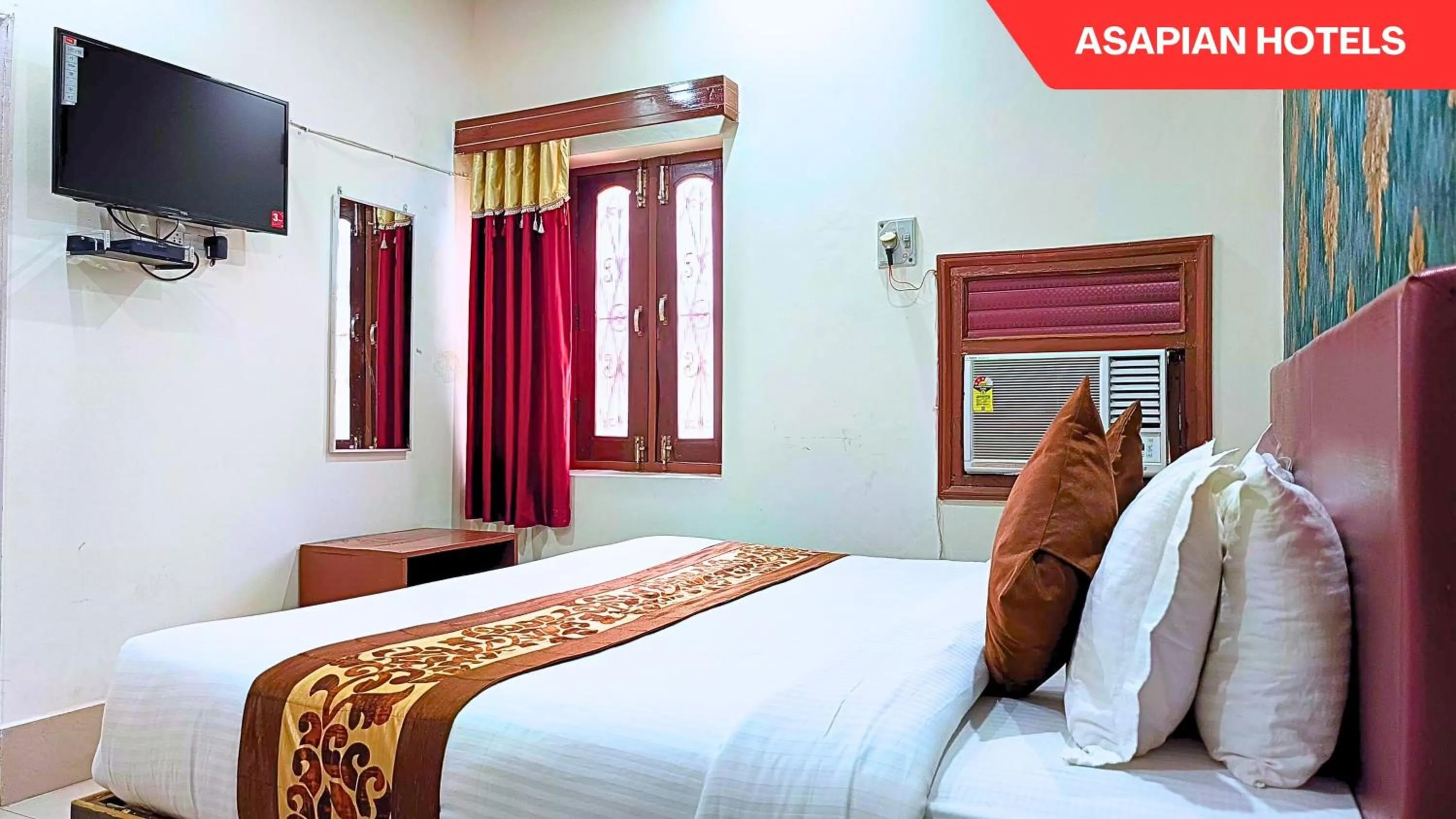 Bed in Hotel Vijay Deluxe