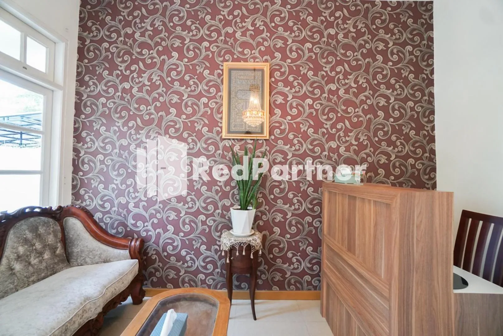 Living room in Fazza Syariah Mitra RedDoorz