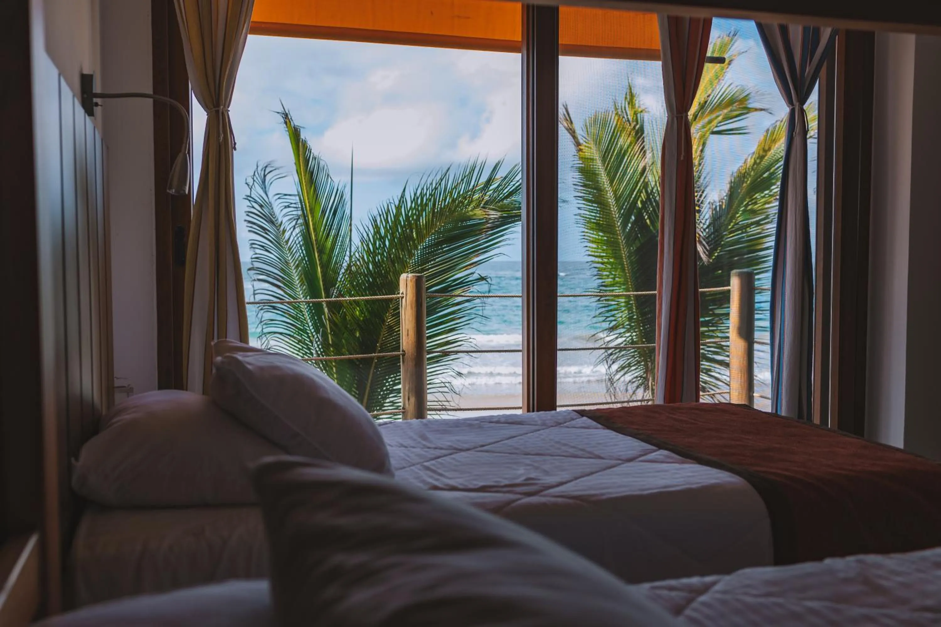 Bed in Mi Playa Galapagos Beachfront Apartments