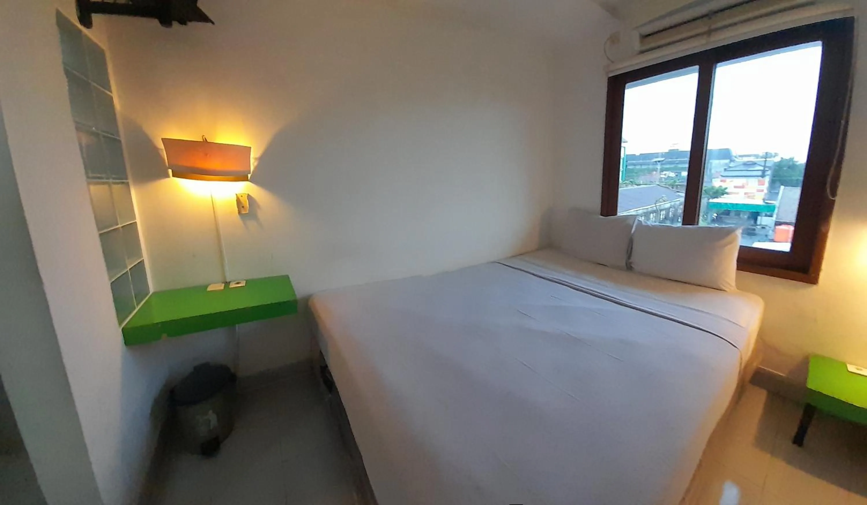 Bed in The Green Winotosastro Hotel Yogyakarta