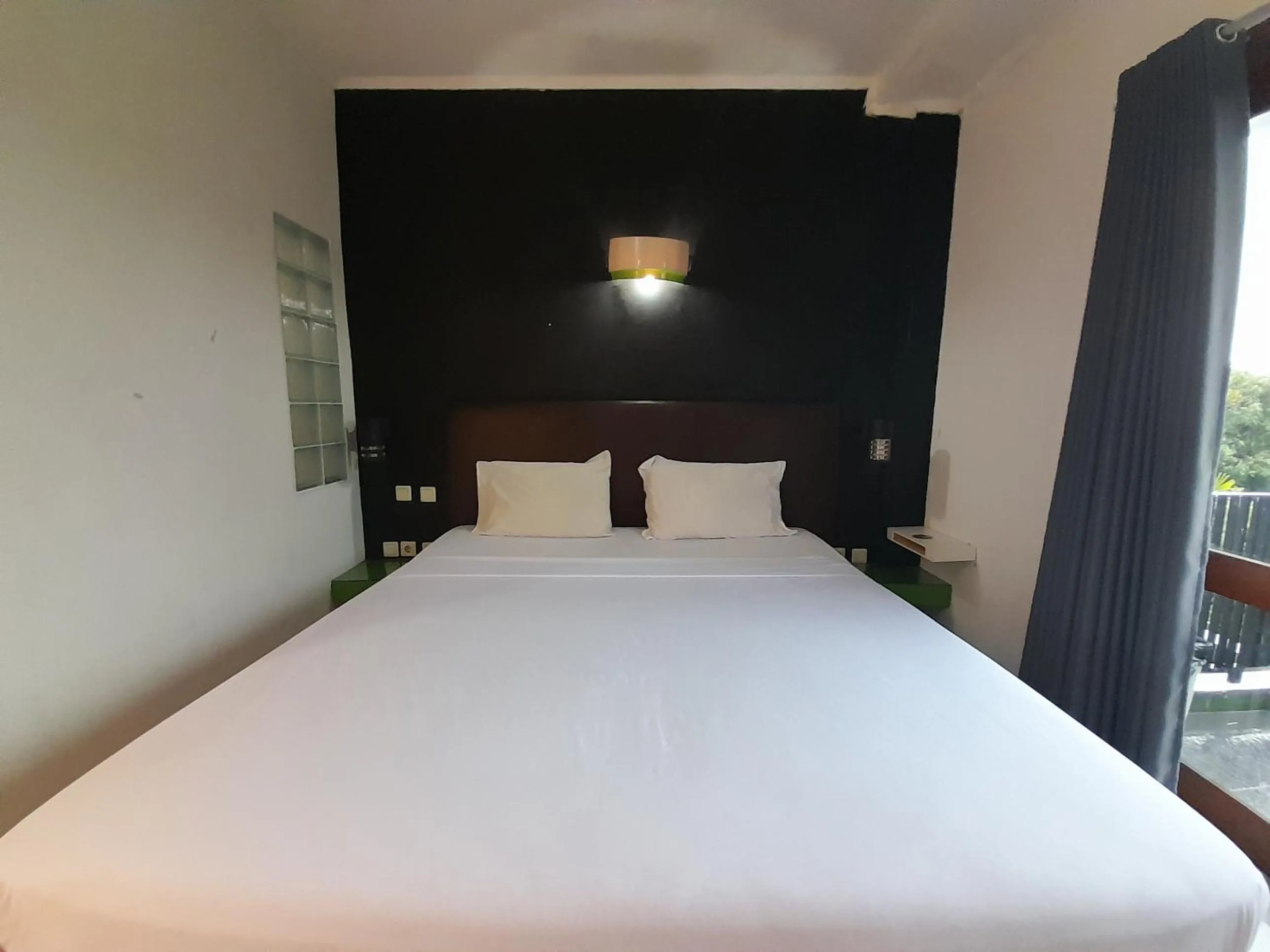 Bed in The Green Winotosastro Hotel Yogyakarta