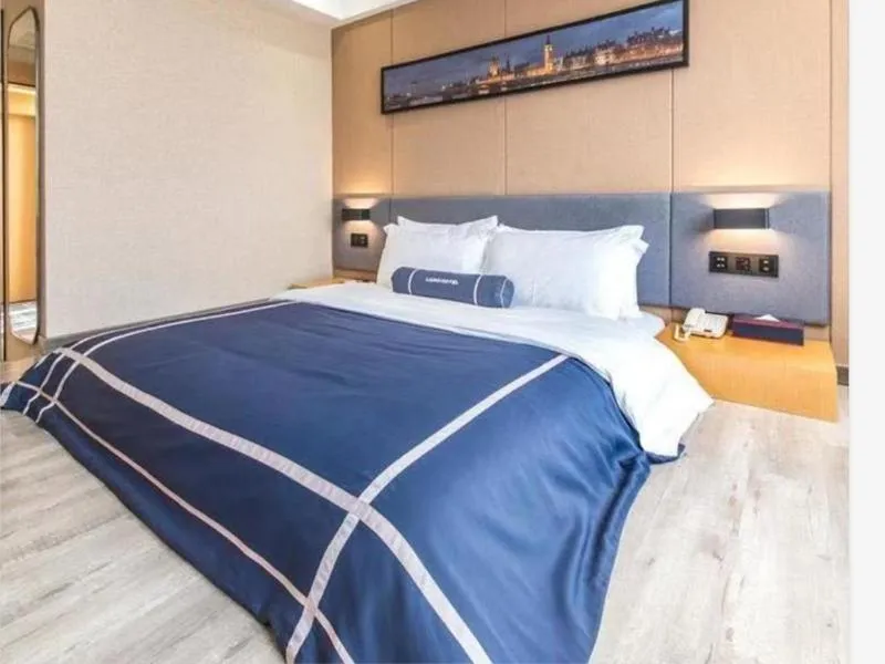 Bed in LanOu Hotel Yancheng Dafeng Yongtai Plaza