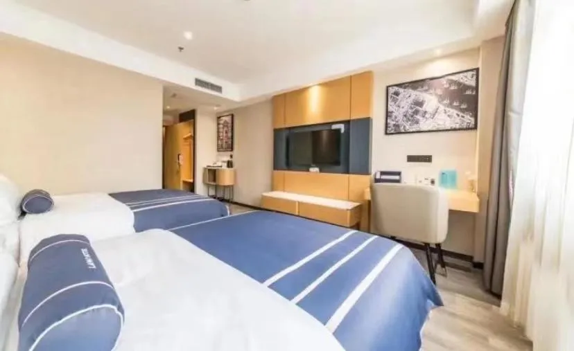 Bed in LanOu Hotel Yancheng Dafeng Yongtai Plaza