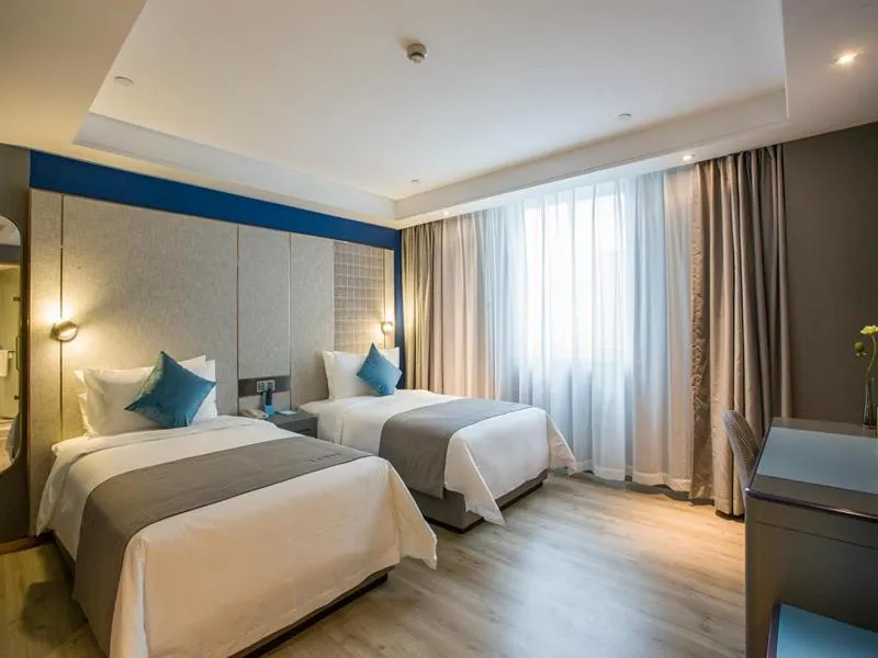 Bed in LanOu Hotel Zhenjiang Runzhou District Railway Station