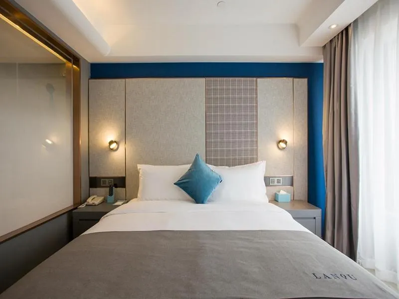 Bed in LanOu Hotel Zhenjiang Runzhou District Railway Station