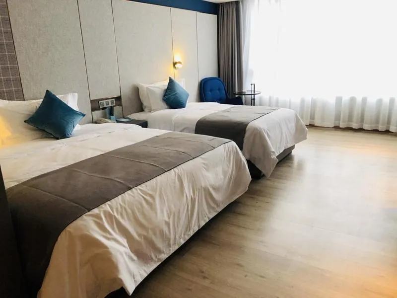 Bed in LanOu Hotel Zhenjiang Runzhou District Railway Station