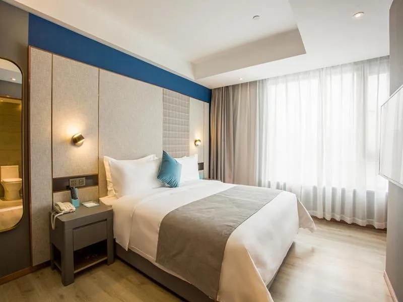 Bed in LanOu Hotel Zhenjiang Runzhou District Railway Station