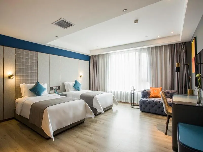 Bed in LanOu Hotel Zhenjiang Runzhou District Railway Station