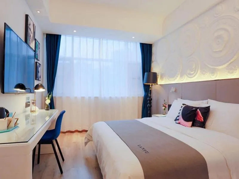 Bed in LanOu Hotel Taixing Wanda Plaza
