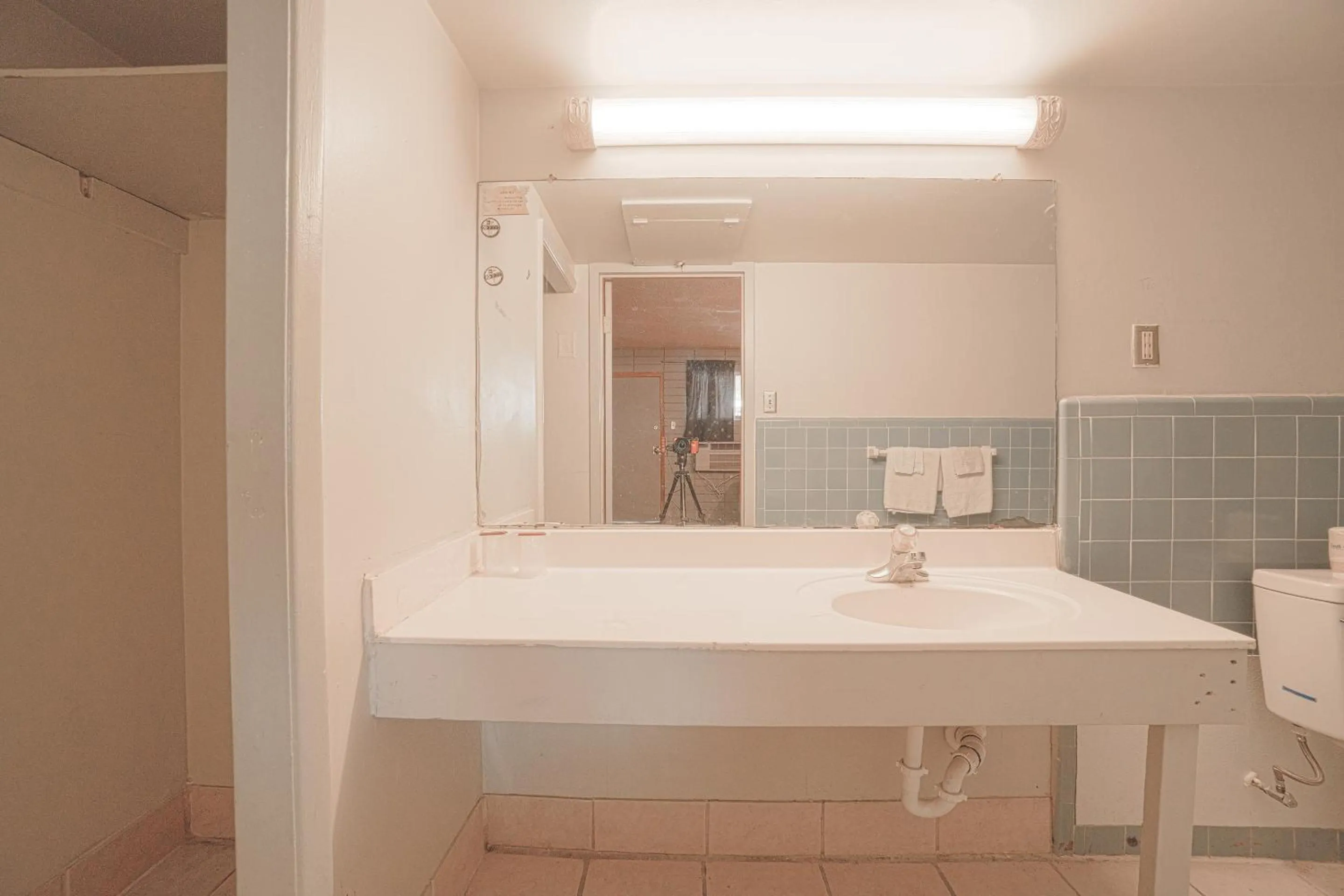 Bathroom in Town & Country Motel Bossier City by OYO