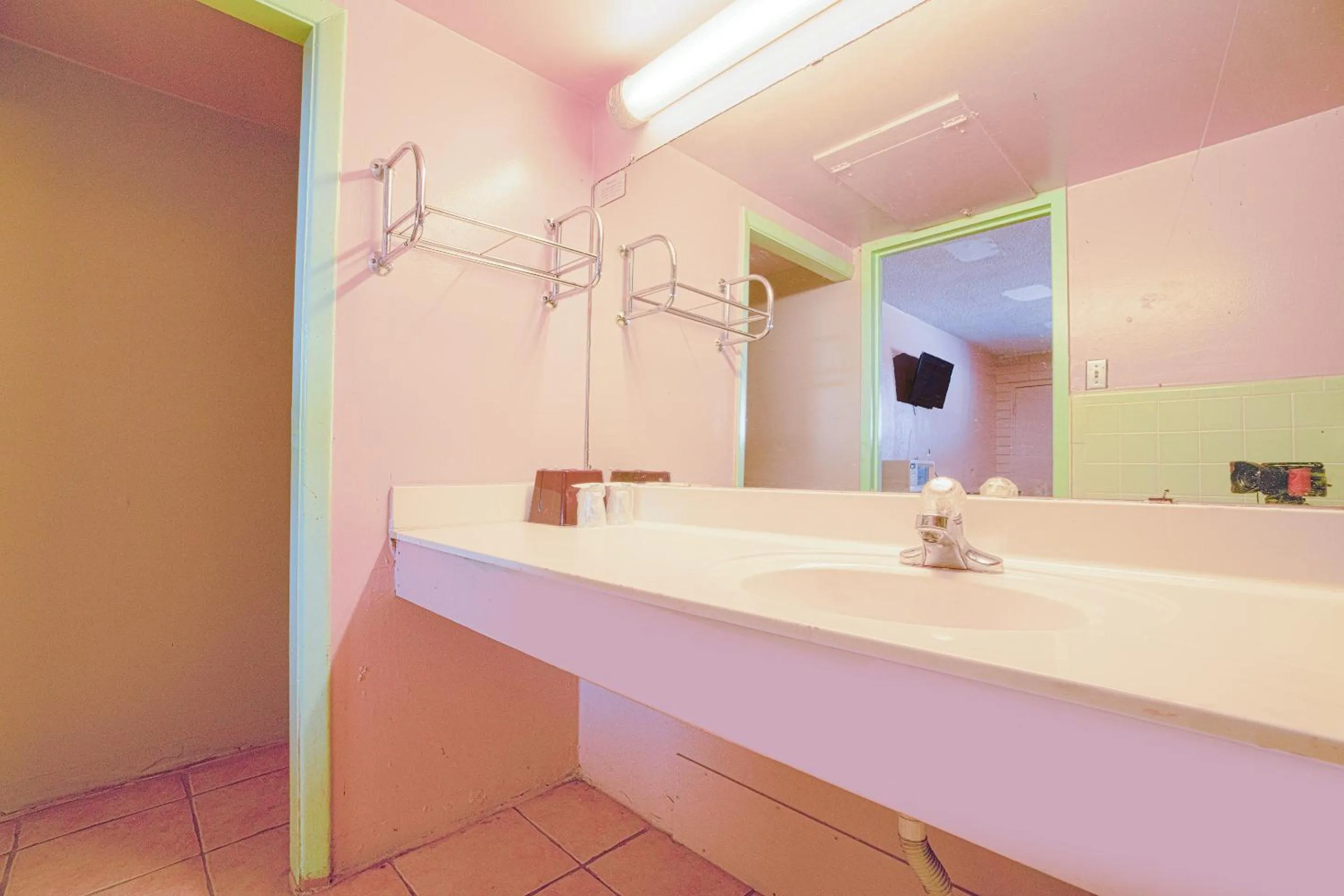 Bathroom in Town & Country Motel Bossier City by OYO