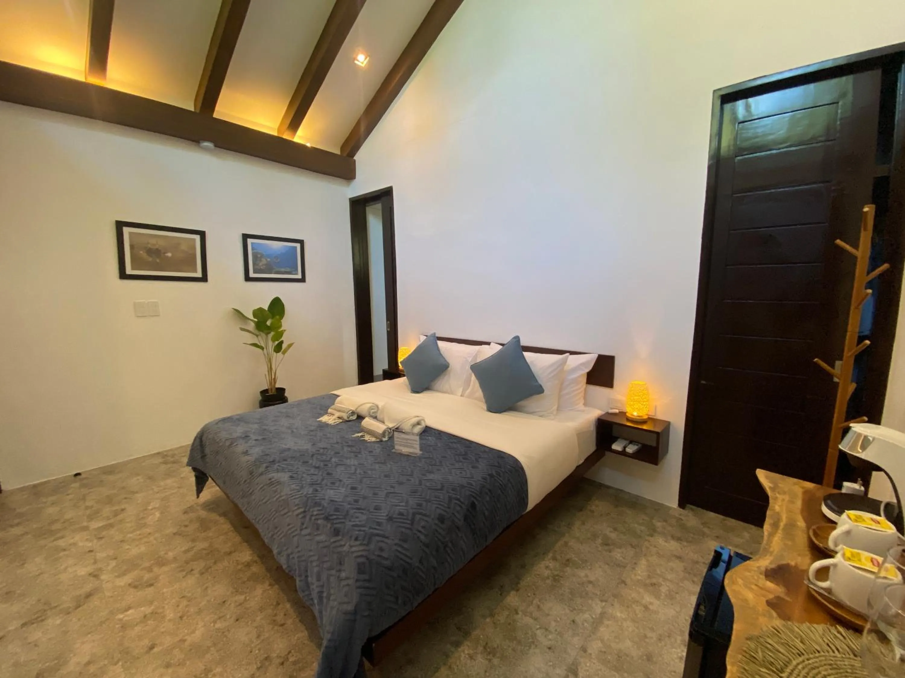 Bed in Amila Dive Beach Resort