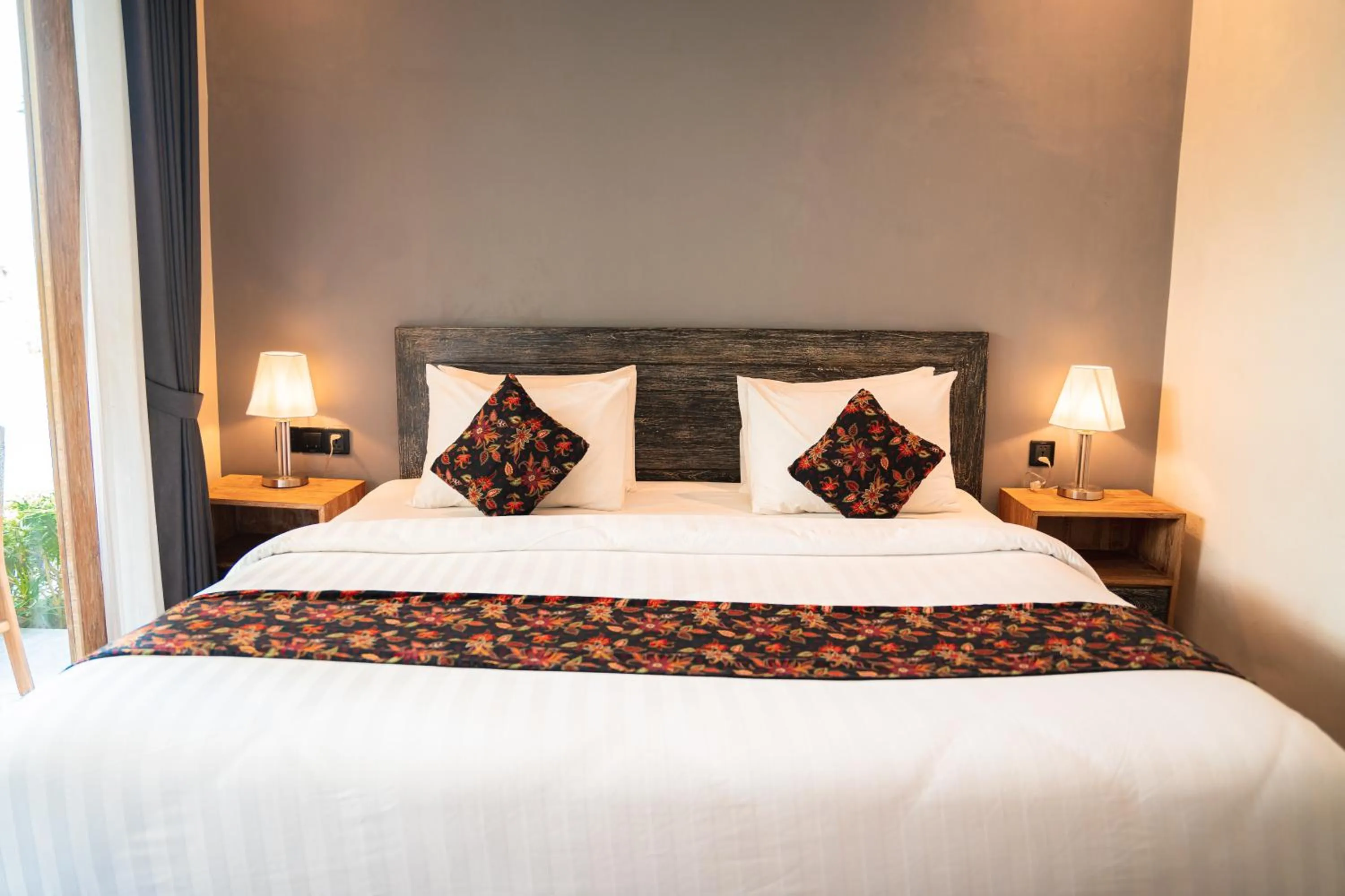 Bed in MAHALONA BALI STAY