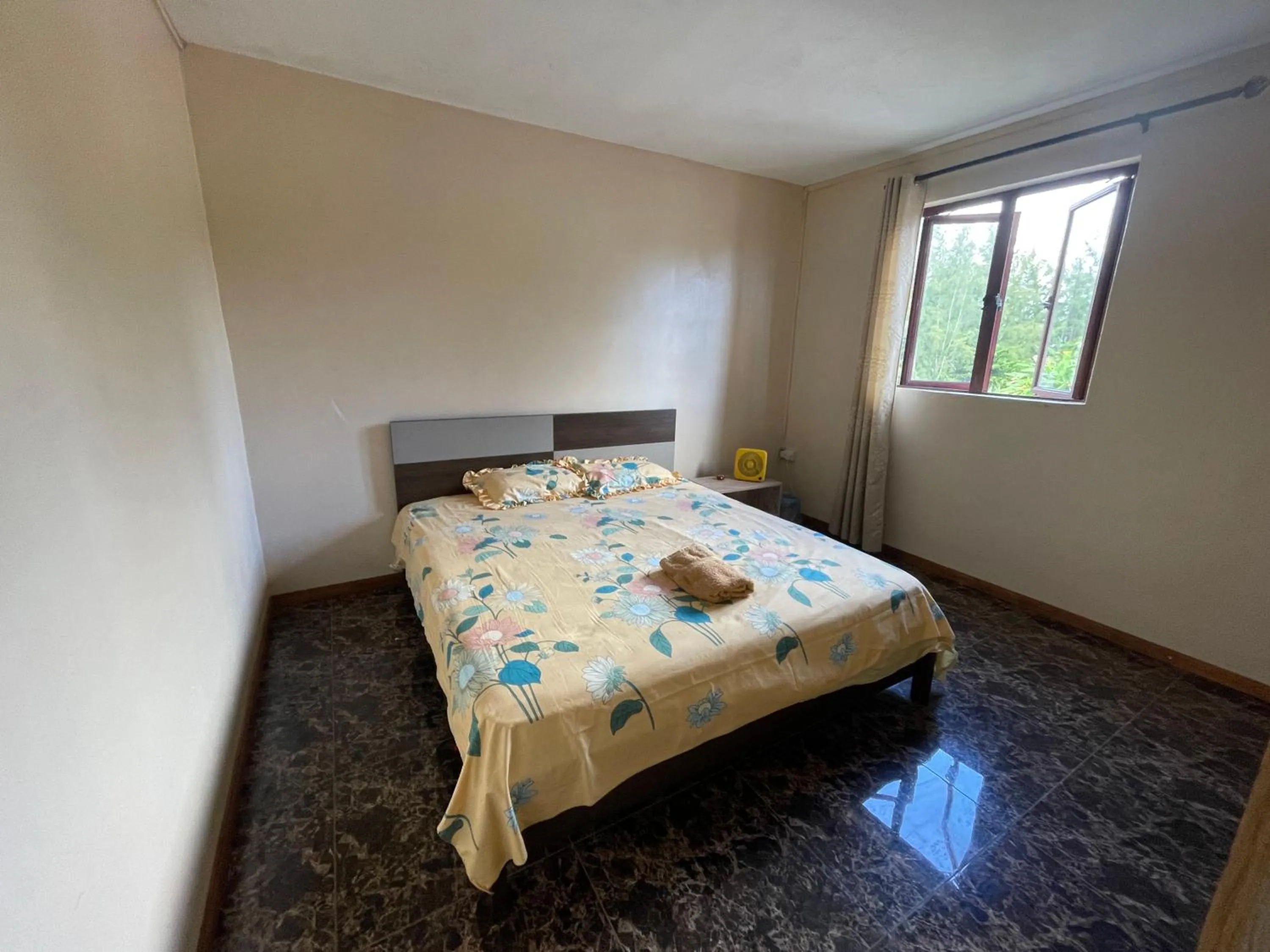 Bed in Riambel Paradise Inn Luxury Room