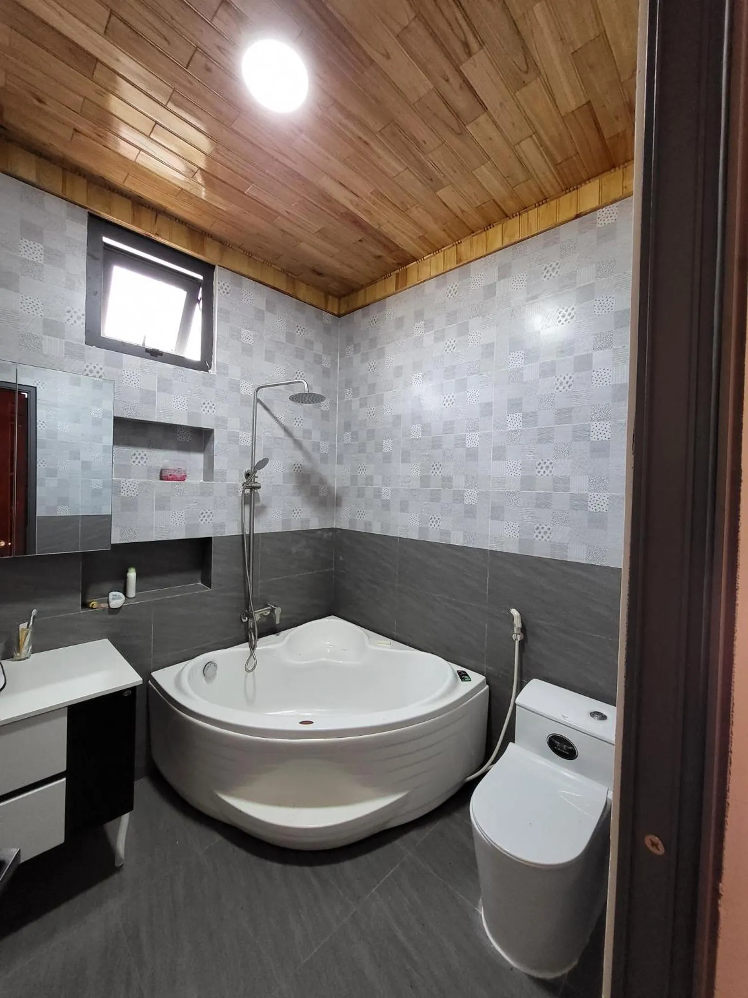Bathroom in T'Farmstay villa and resort Buon Ma Thuot City