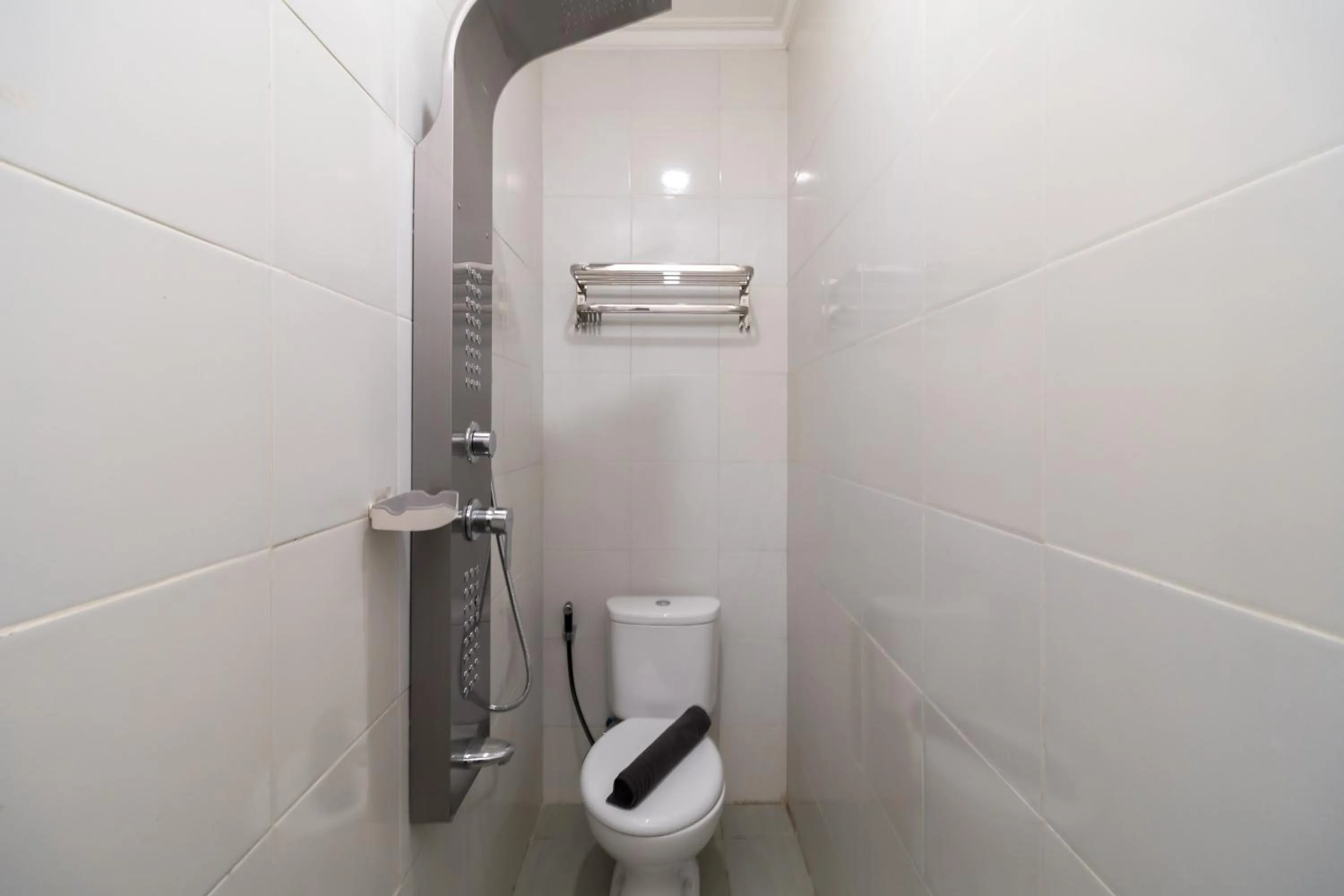 Bathroom in Urbanview Hotel Bizhome Artha Gading Boulevard by RedDoorz