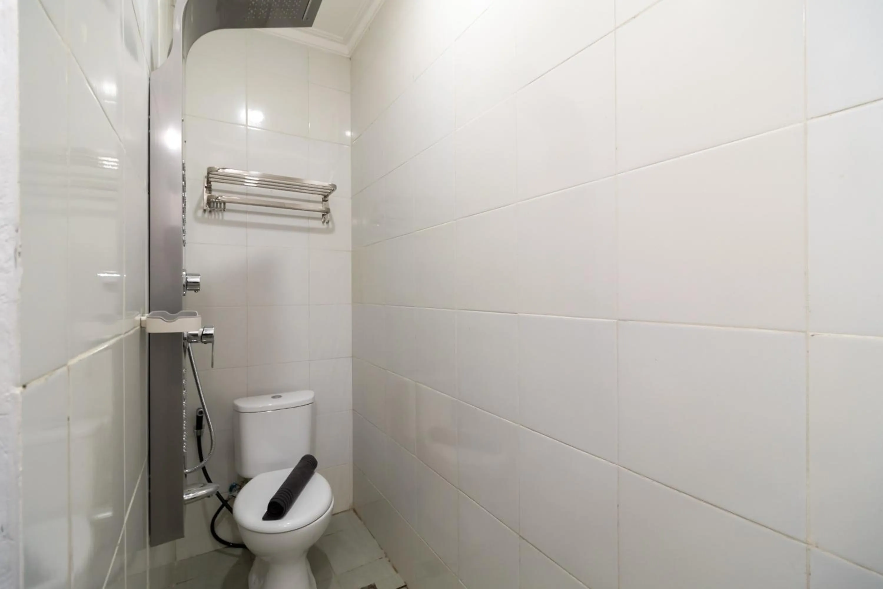 Bathroom in Urbanview Hotel Bizhome Artha Gading Boulevard by RedDoorz