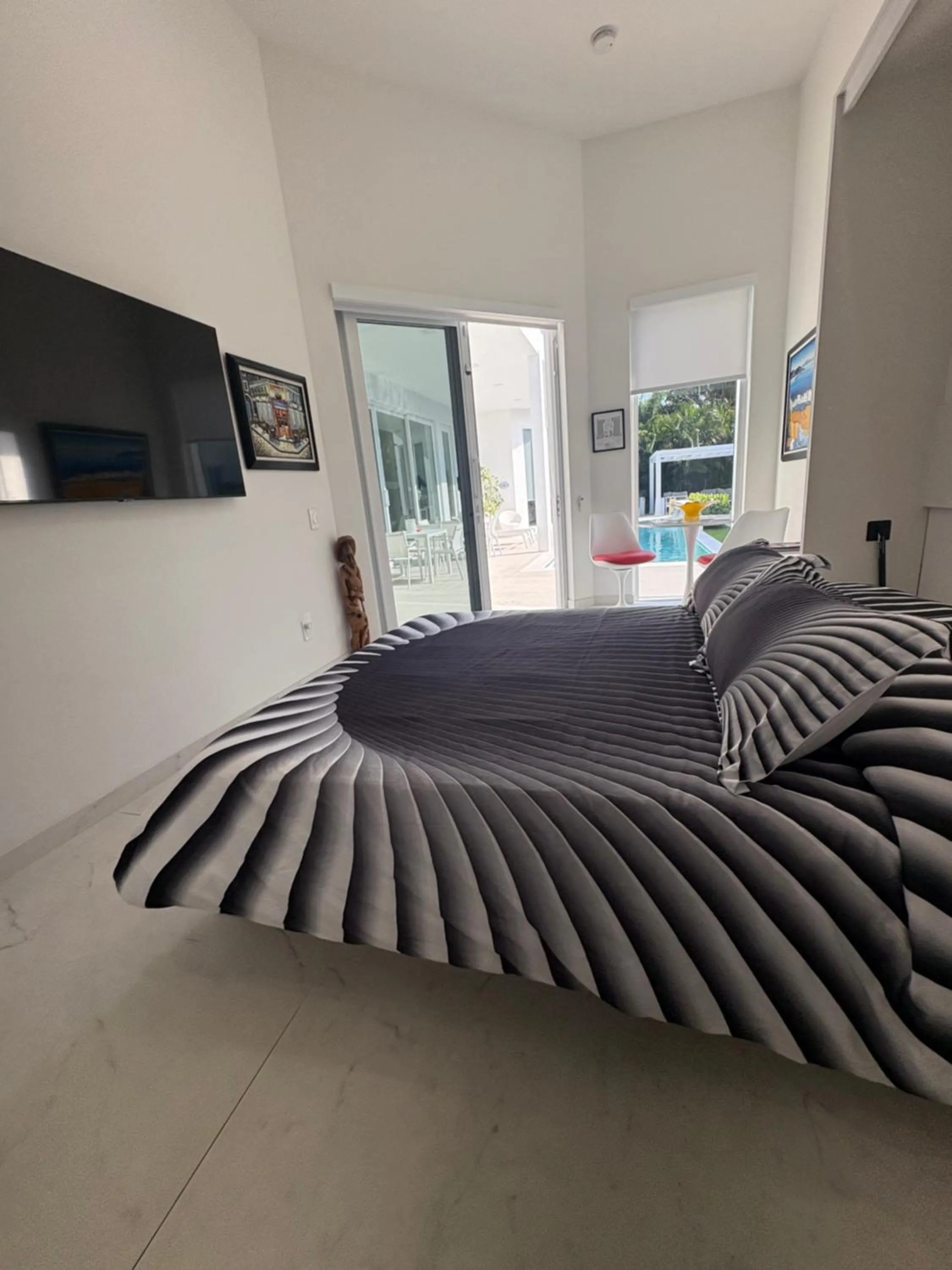 Bed in Men only clothing option guesthouse near Wilton Manors