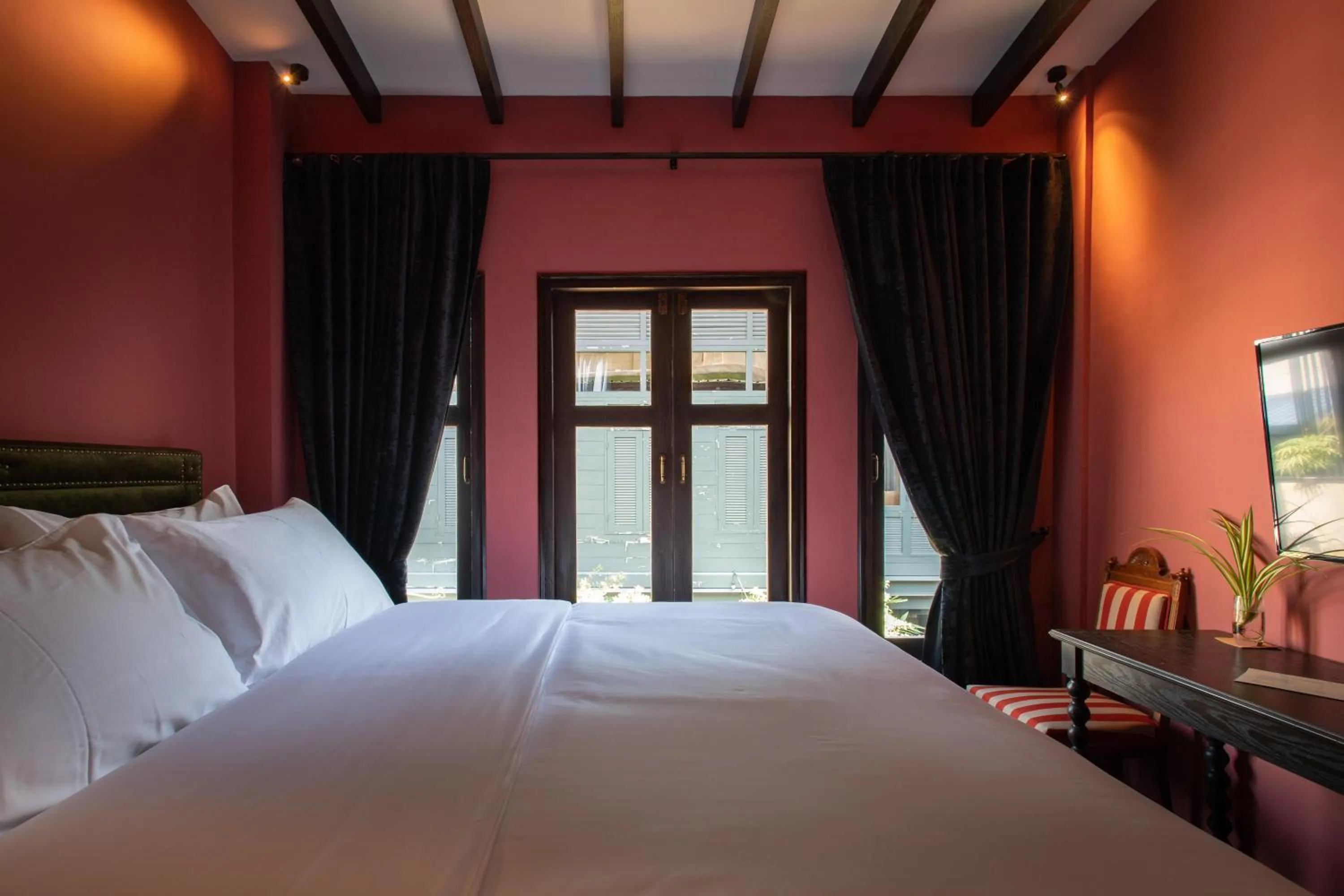 Bed in Baan Tuk Din Hotel