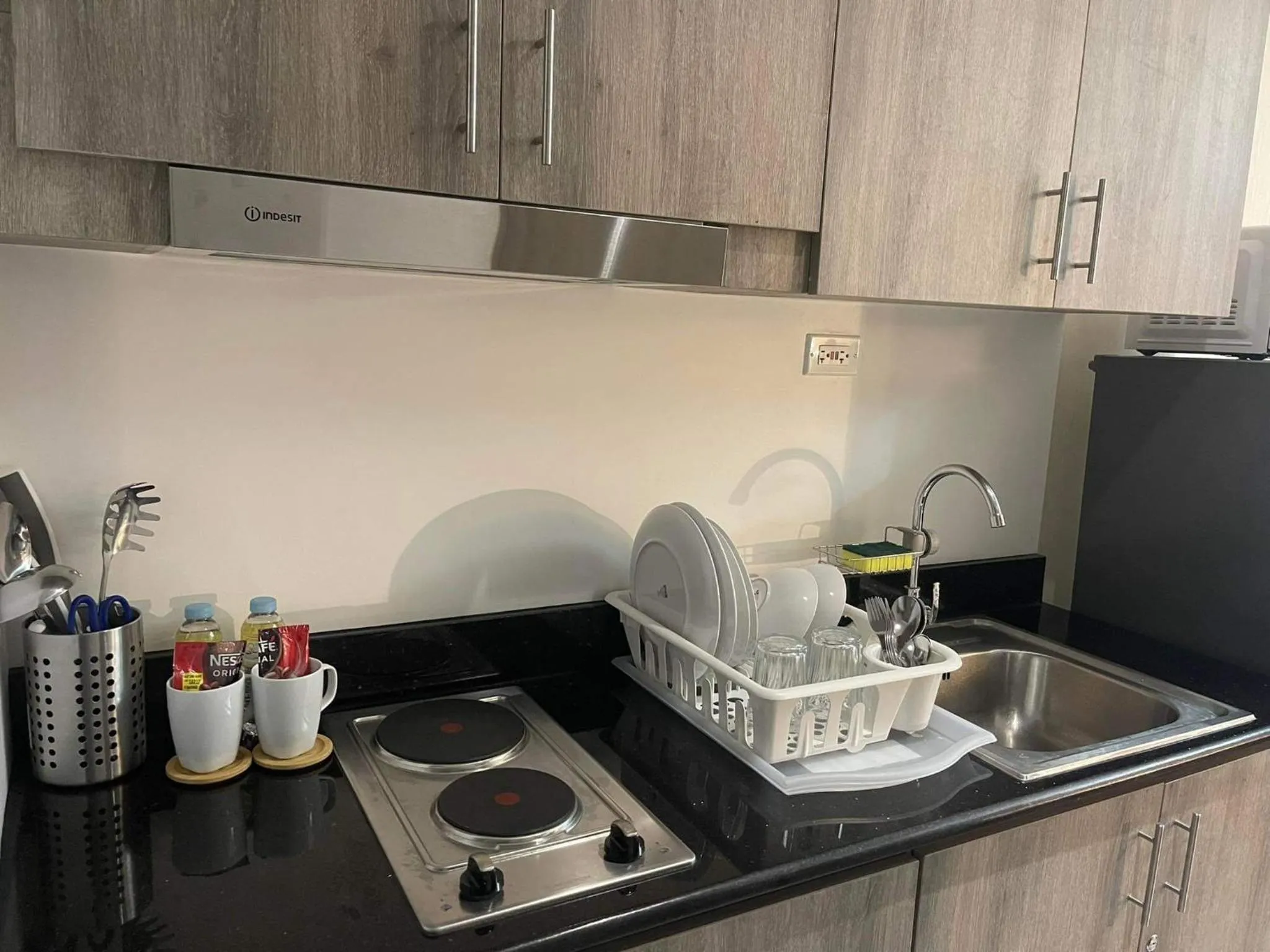 Kitchen or kitchenette in Staycation Mandaluyong Fame residences greenfield district by darpm