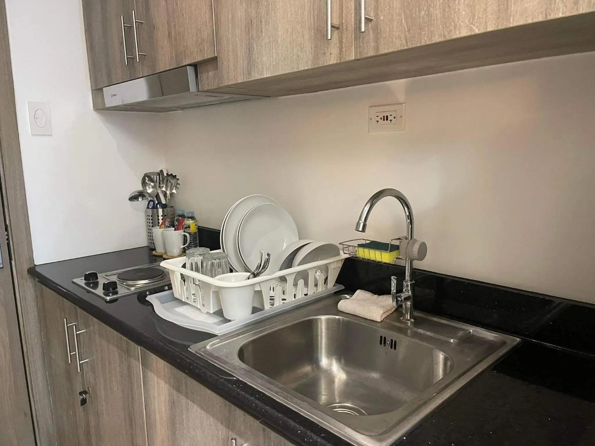 Kitchen or kitchenette in Staycation Mandaluyong Fame residences greenfield district by darpm