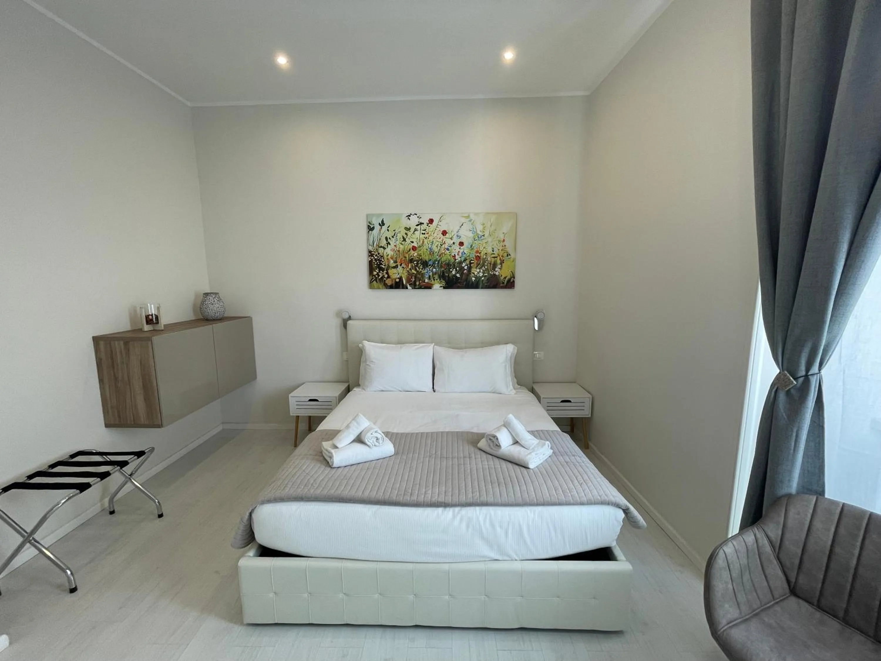 Bed in Quintus Luxury Suites