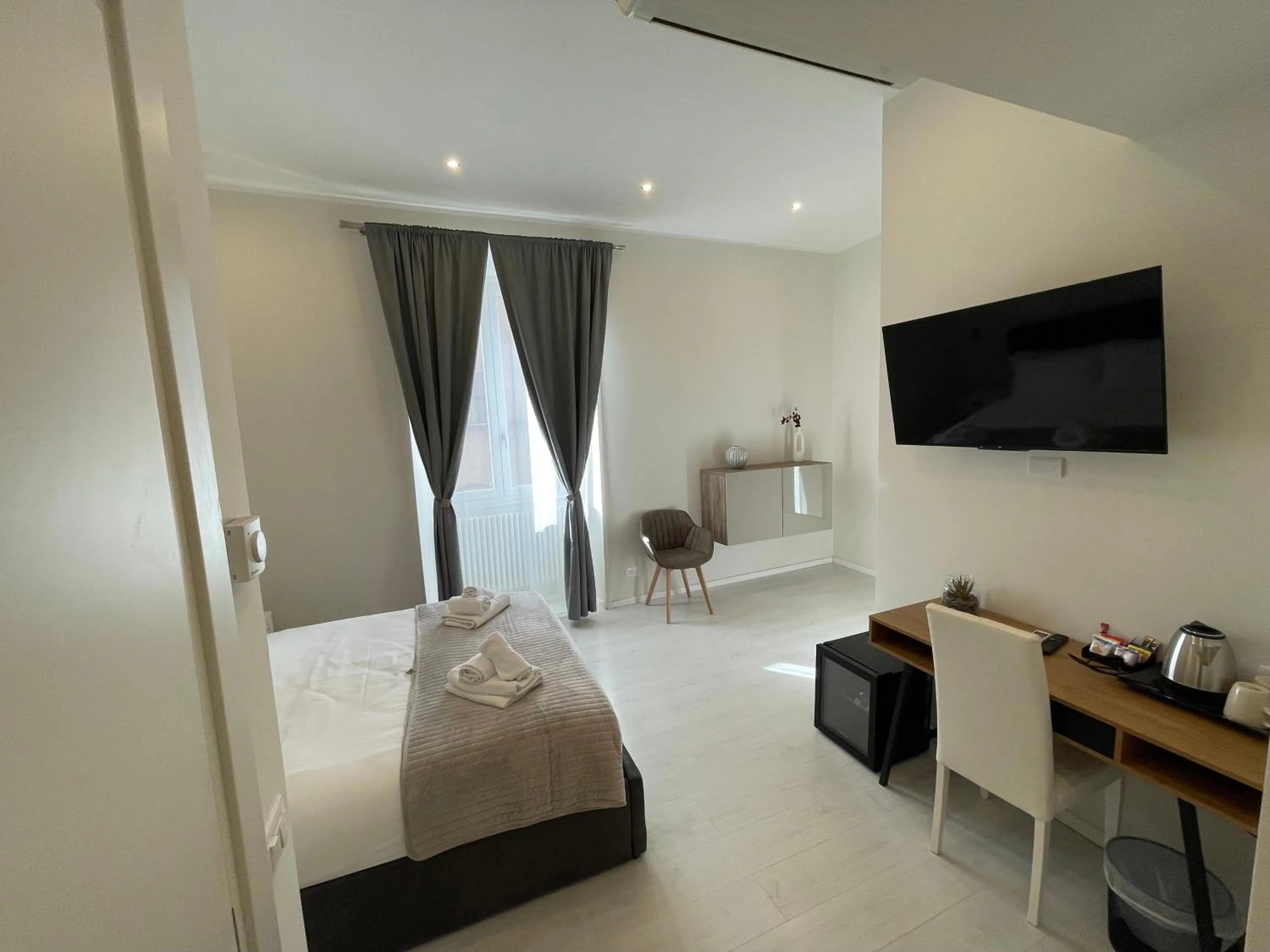 Bed in Quintus Luxury Suites