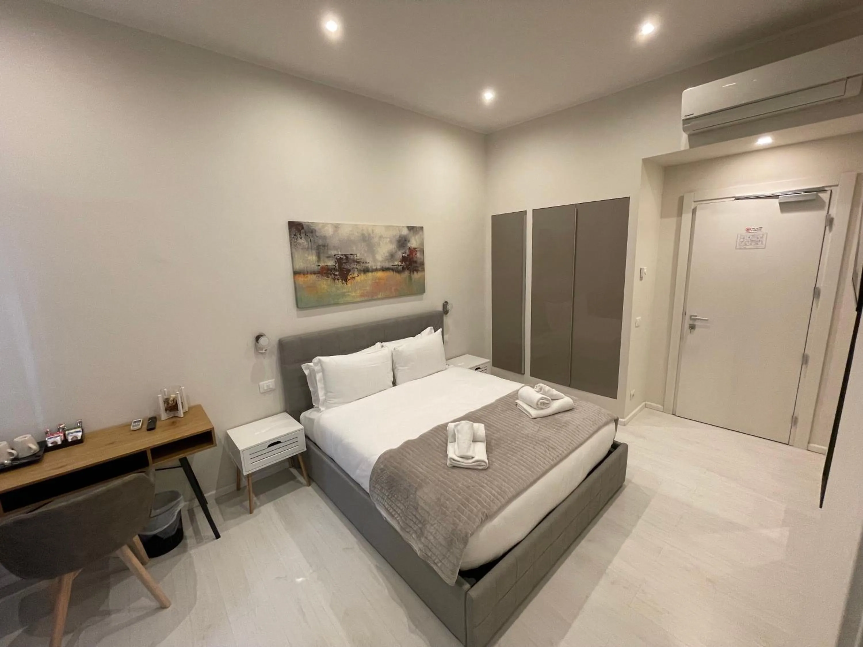 Bed in Quintus Luxury Suites