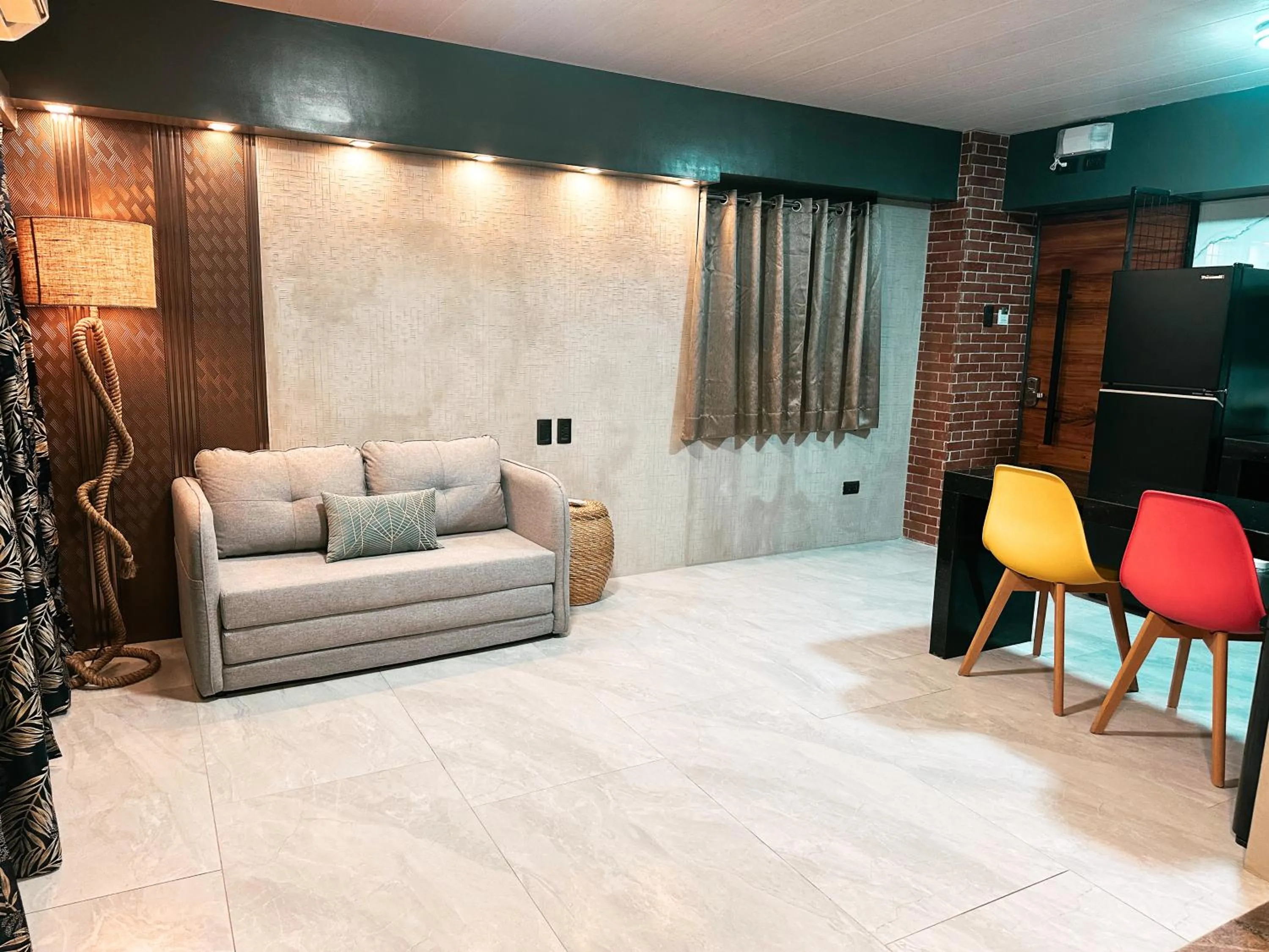 Living room in Blue Tulip - 4mins from Mactan Airport