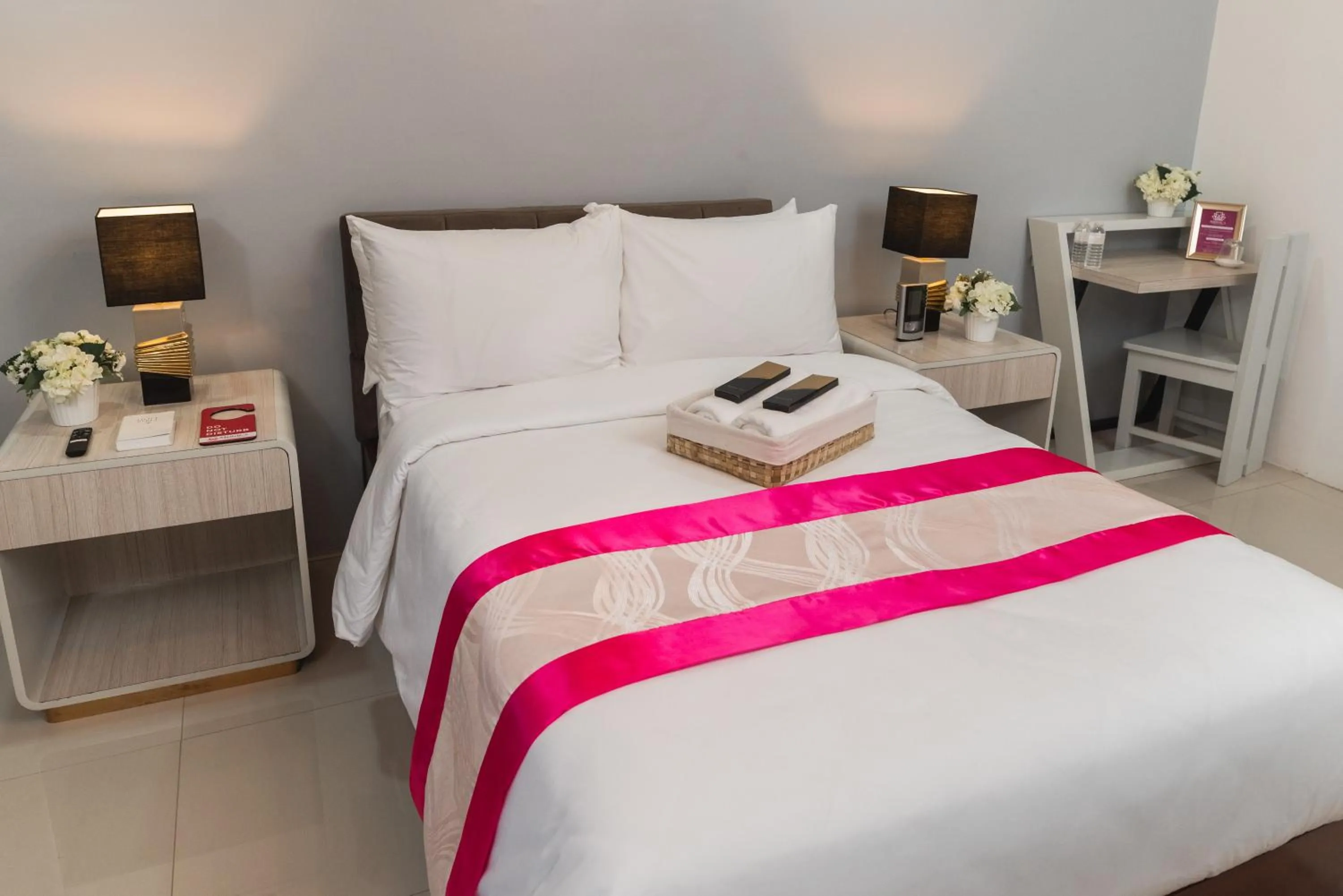 Bed in Monica Midtown Suites