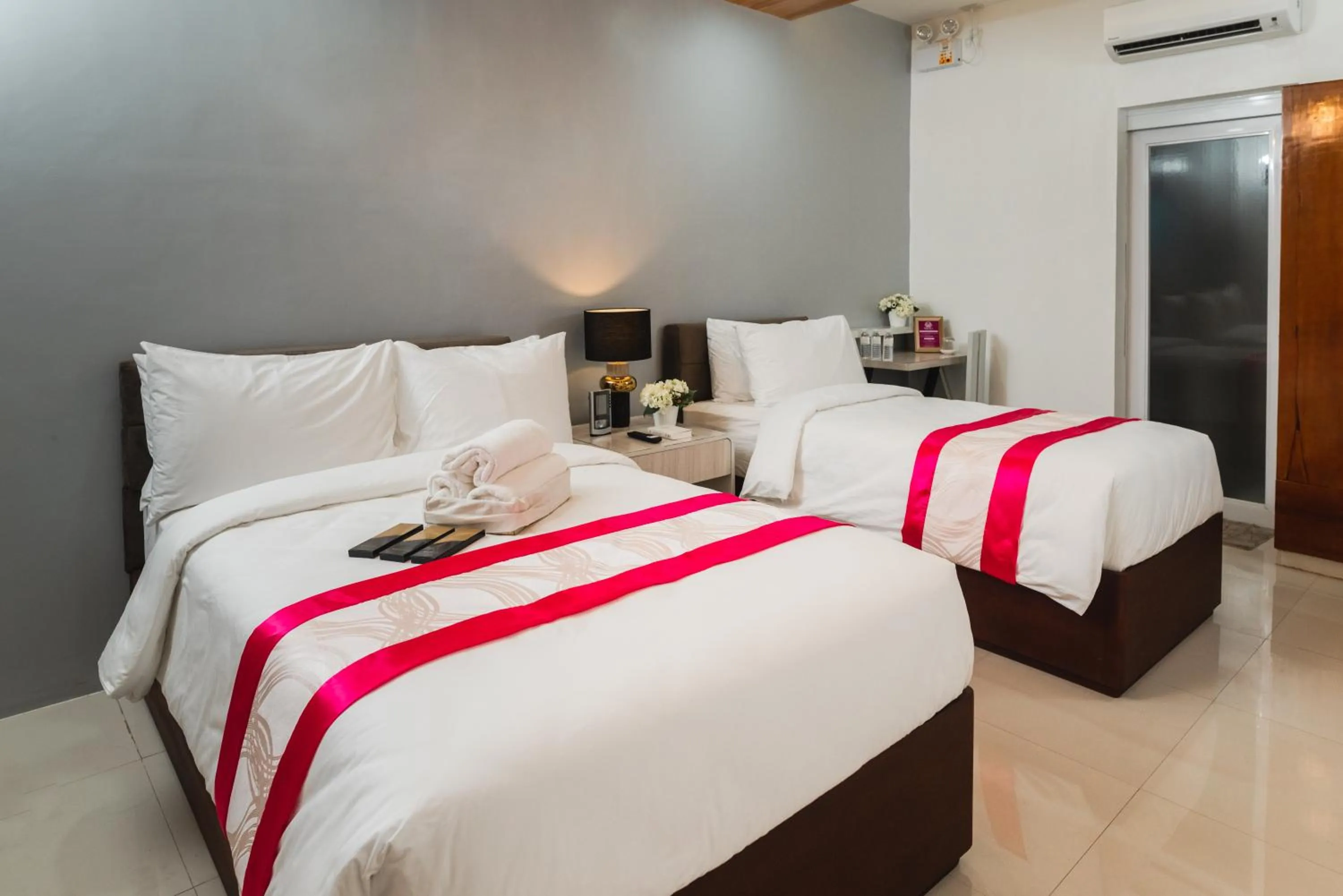 Bed in Monica Midtown Suites