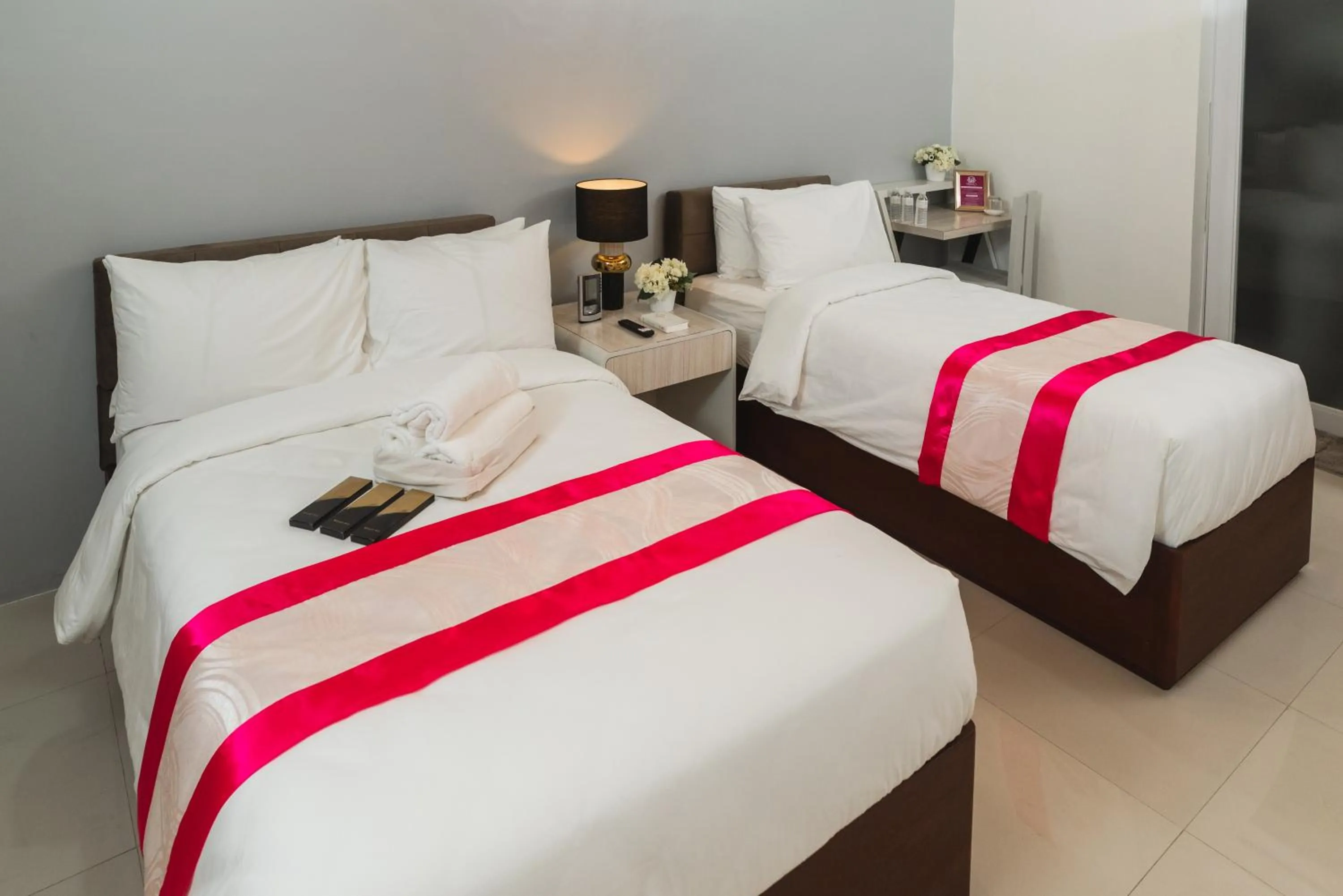 Bed in Monica Midtown Suites