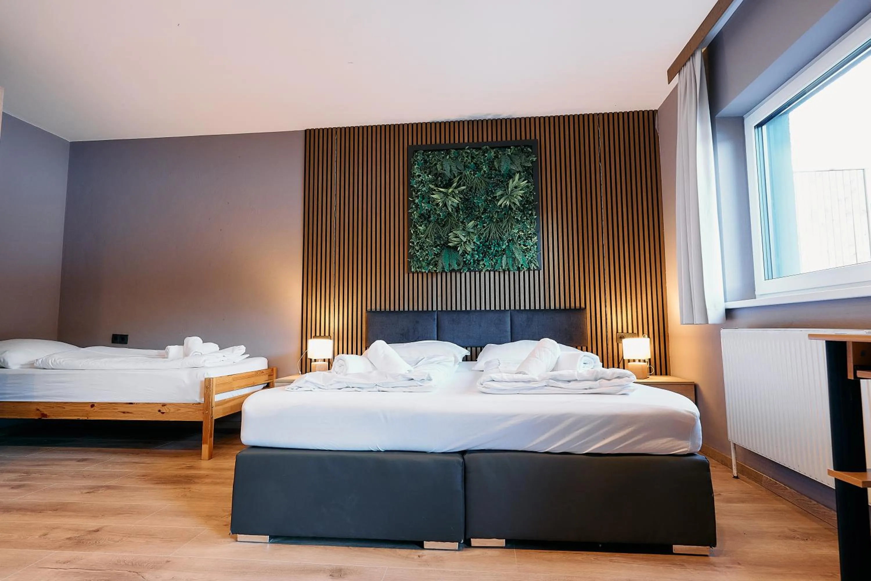 Bed in The Art and Sporthotel