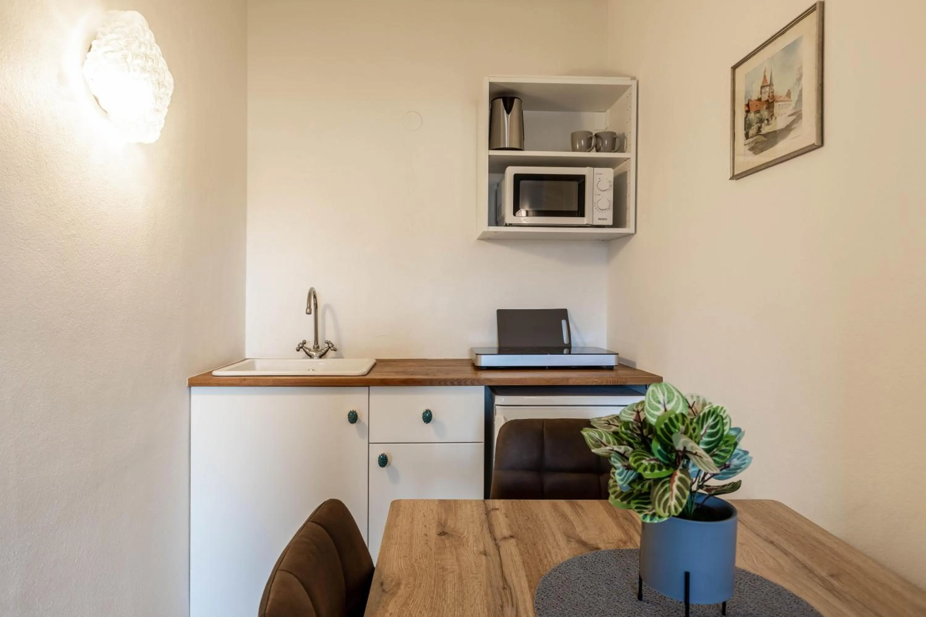 Kitchen or kitchenette in The Art and Sporthotel