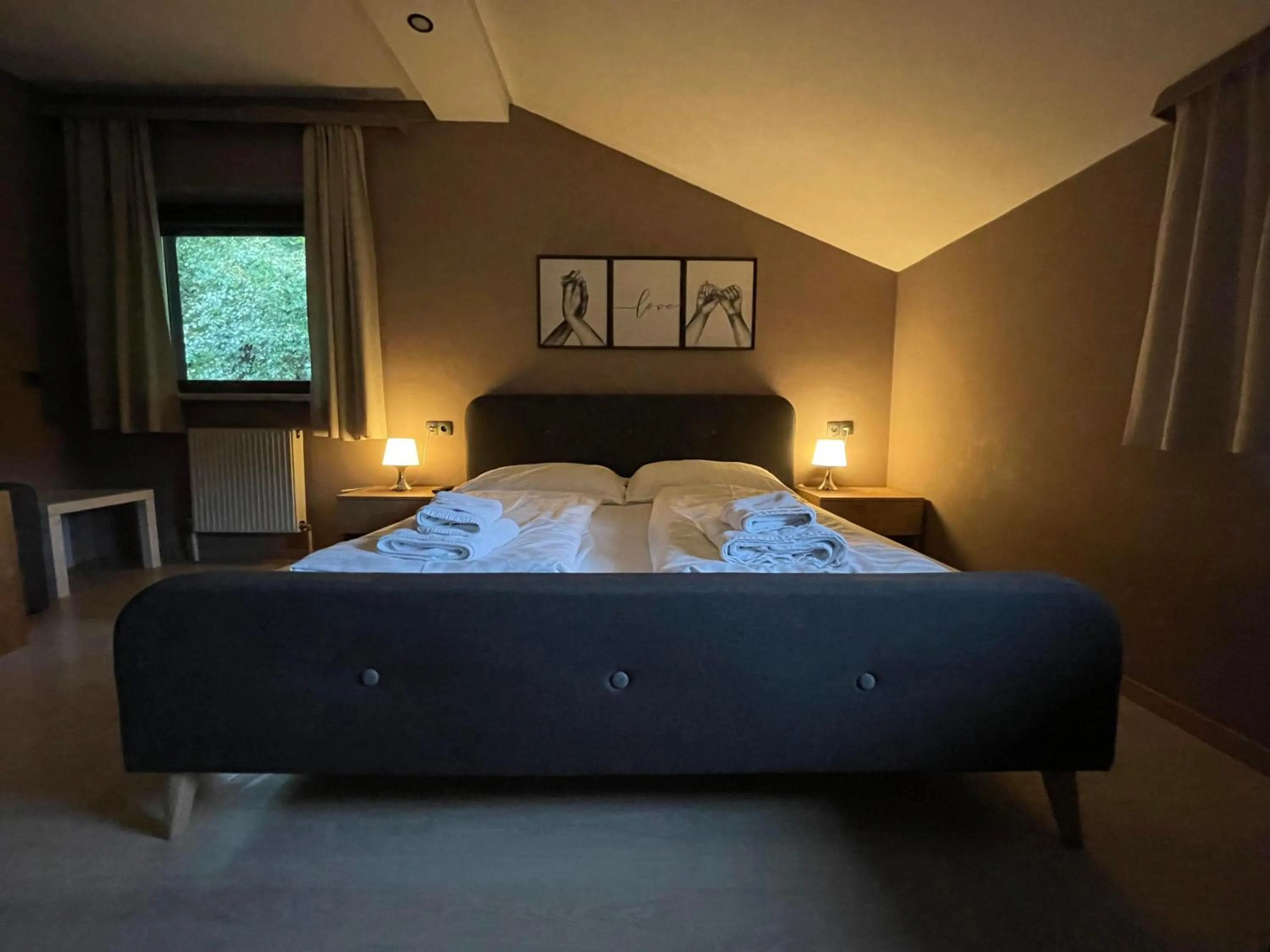 Bed in The Art and Sporthotel