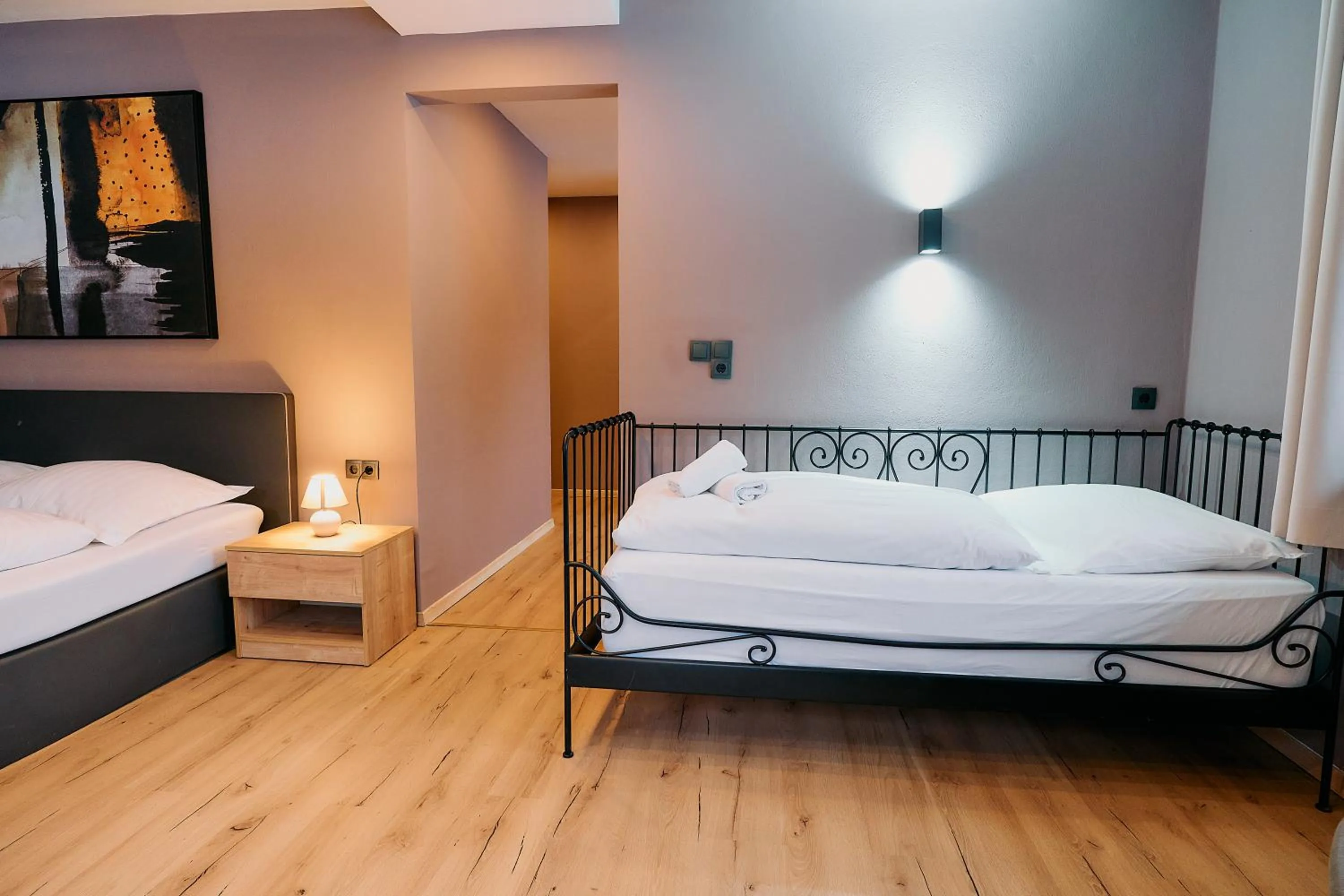 Bed in The Art and Sporthotel