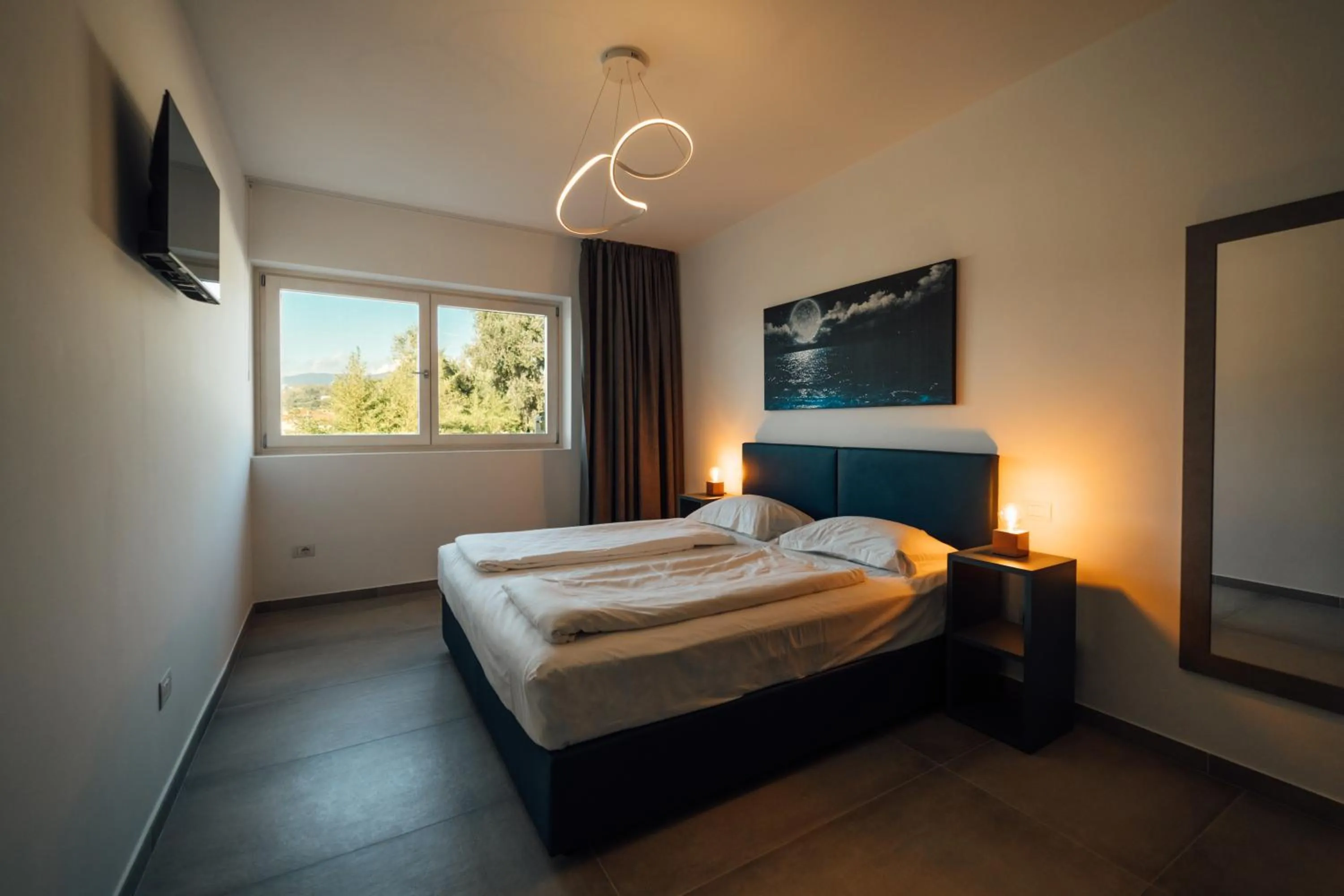 Bed in Apartments Monsurei, Lake view