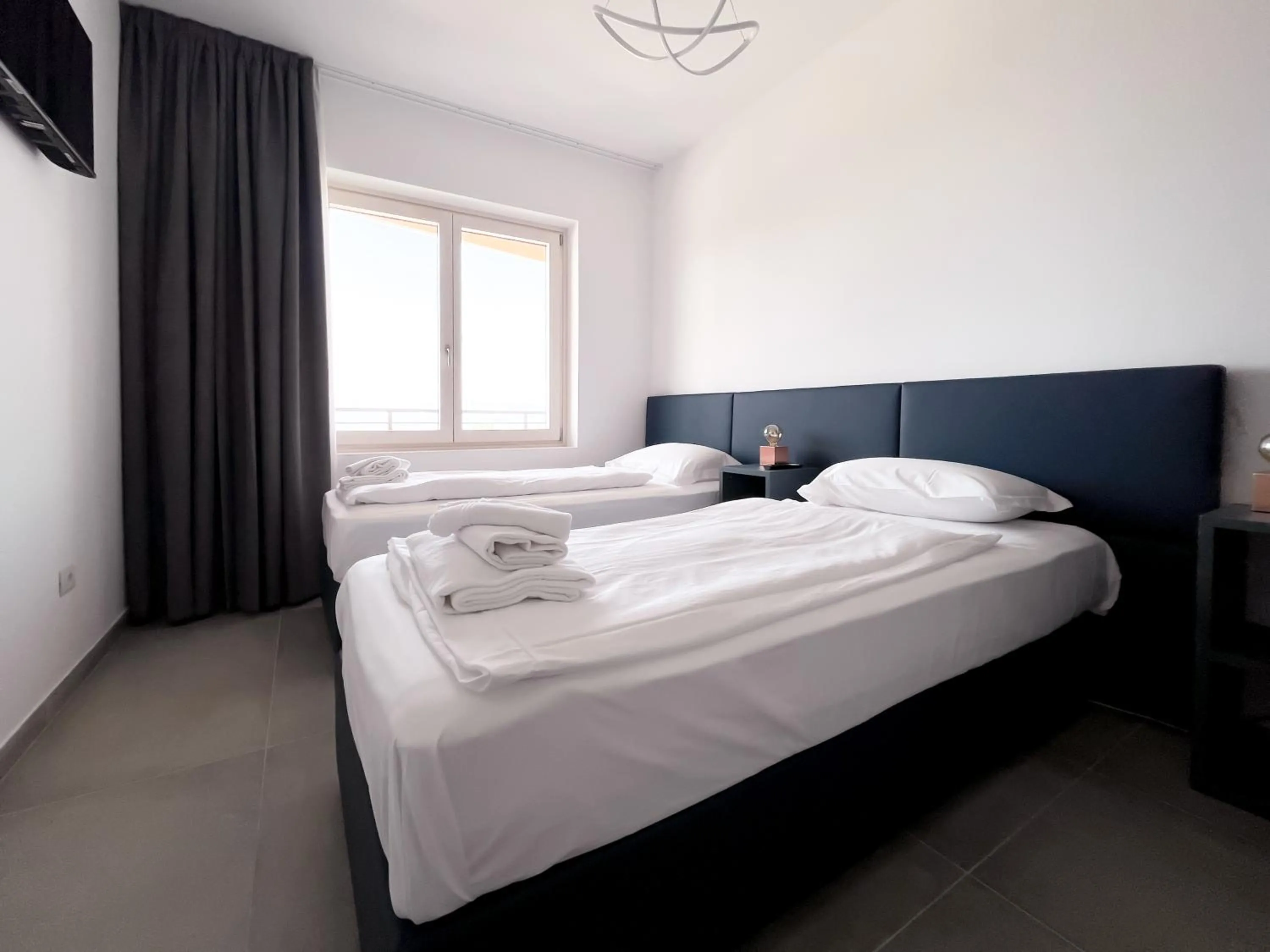 Bed in Apartments Monsurei, Lake view