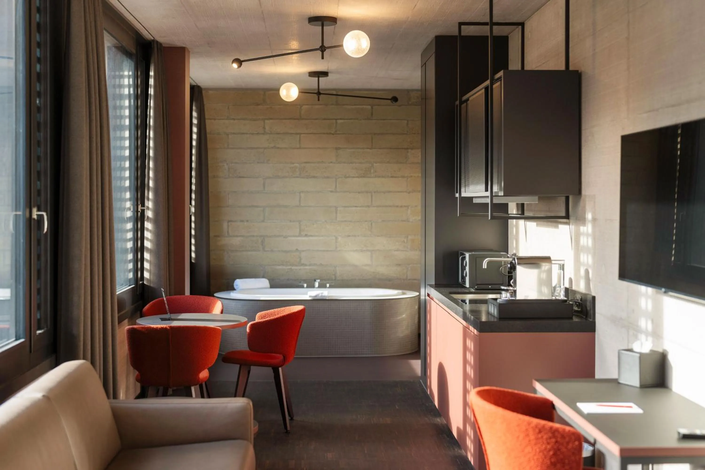 Kitchen or kitchenette in Tailormade Hotel LEO St Gallen