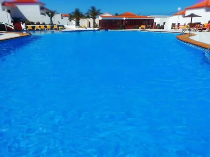 Pool view in Bungalows Castillo Beach